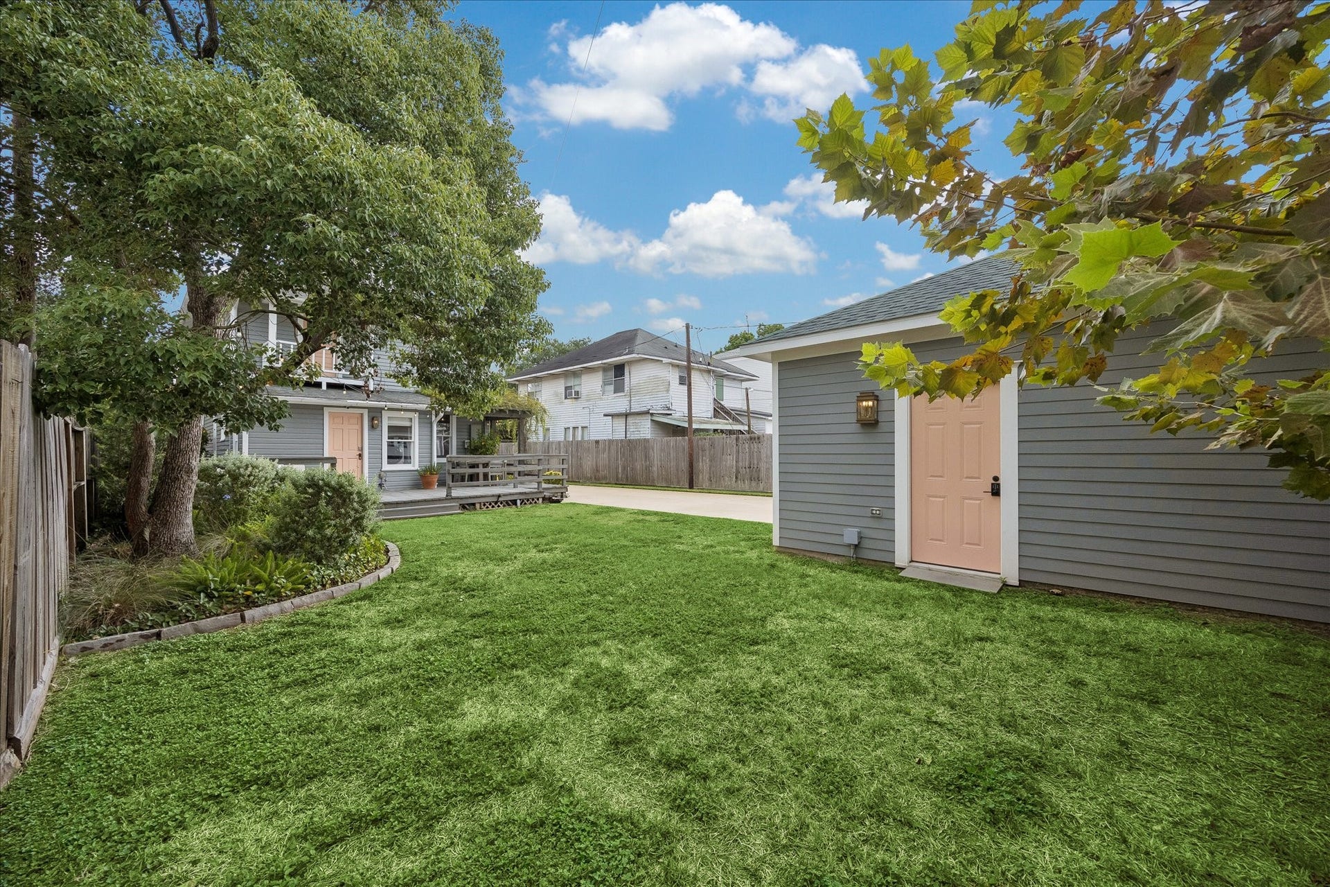 1221 Columbia Street, Houston, TX 77008 Standing at the furthest back corner of the yard offers a perspective of the green space available.