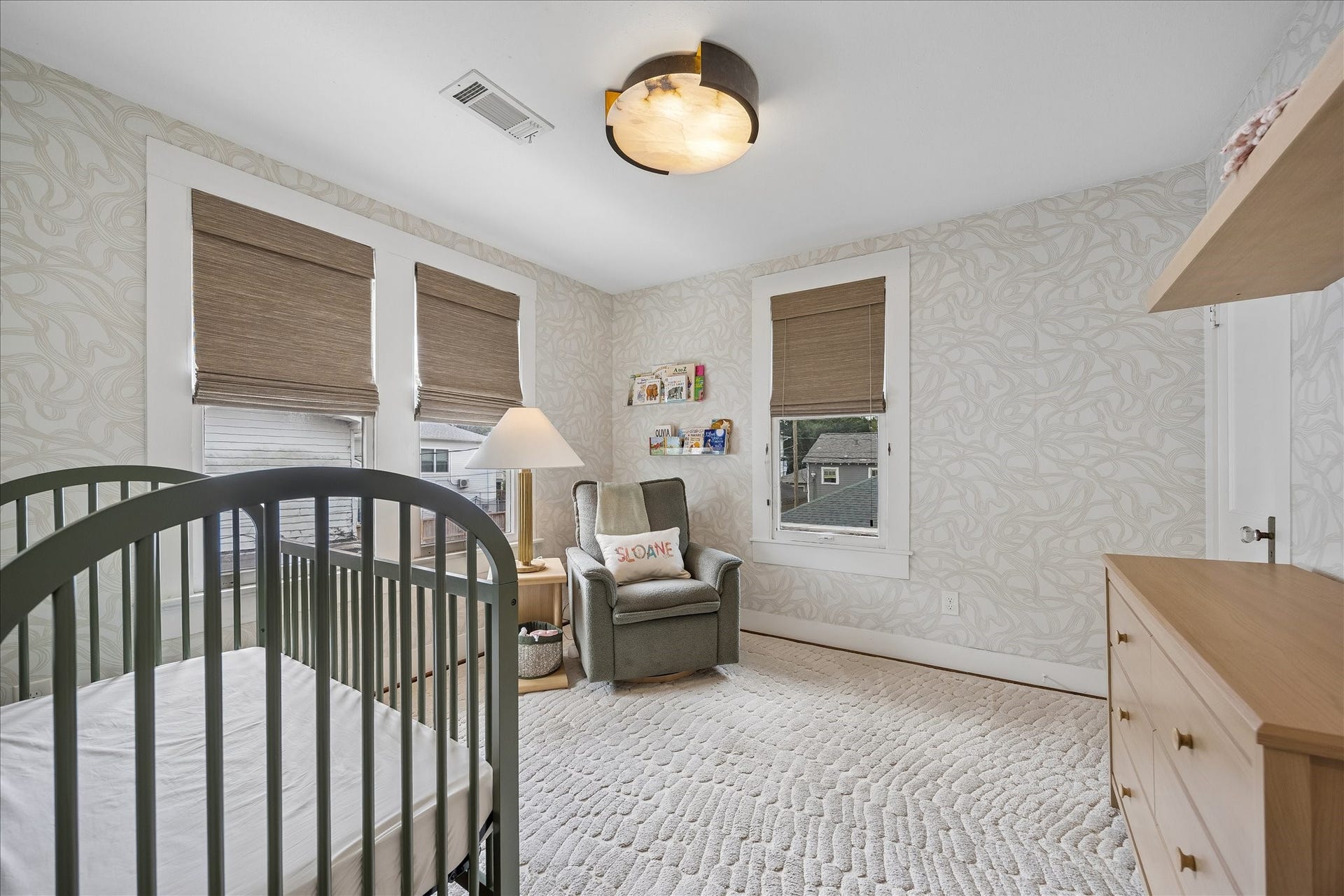 1221 Columbia Street, Houston, TX 77008 The wallpapered bedroom currently set up as a nursery has a nice closet and custom window treatments.