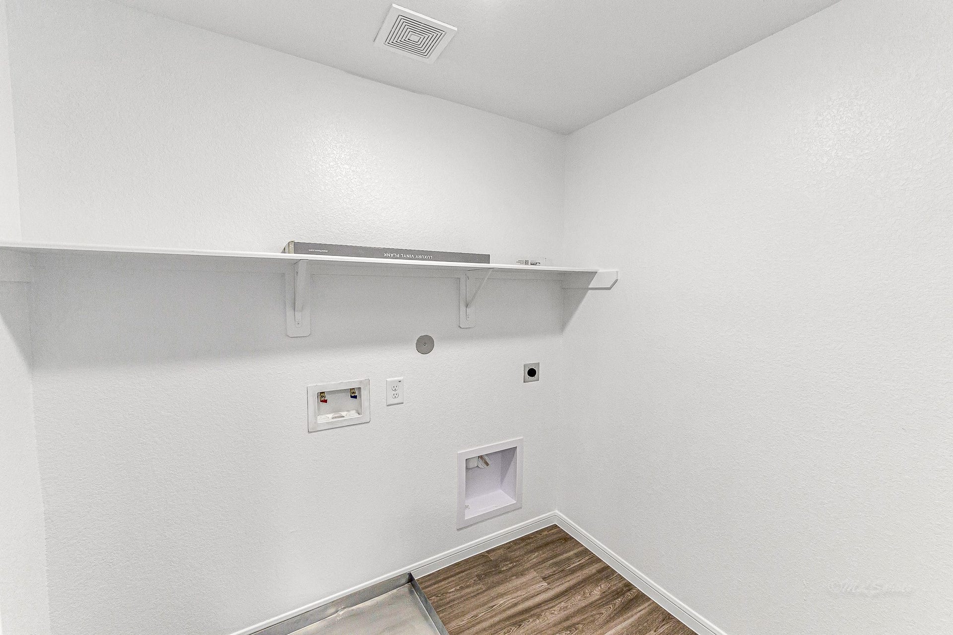 Utility room. BRAND NEW WASHER AND DRYER TO BE INSTALLED PRIOR TO MOVE IN.