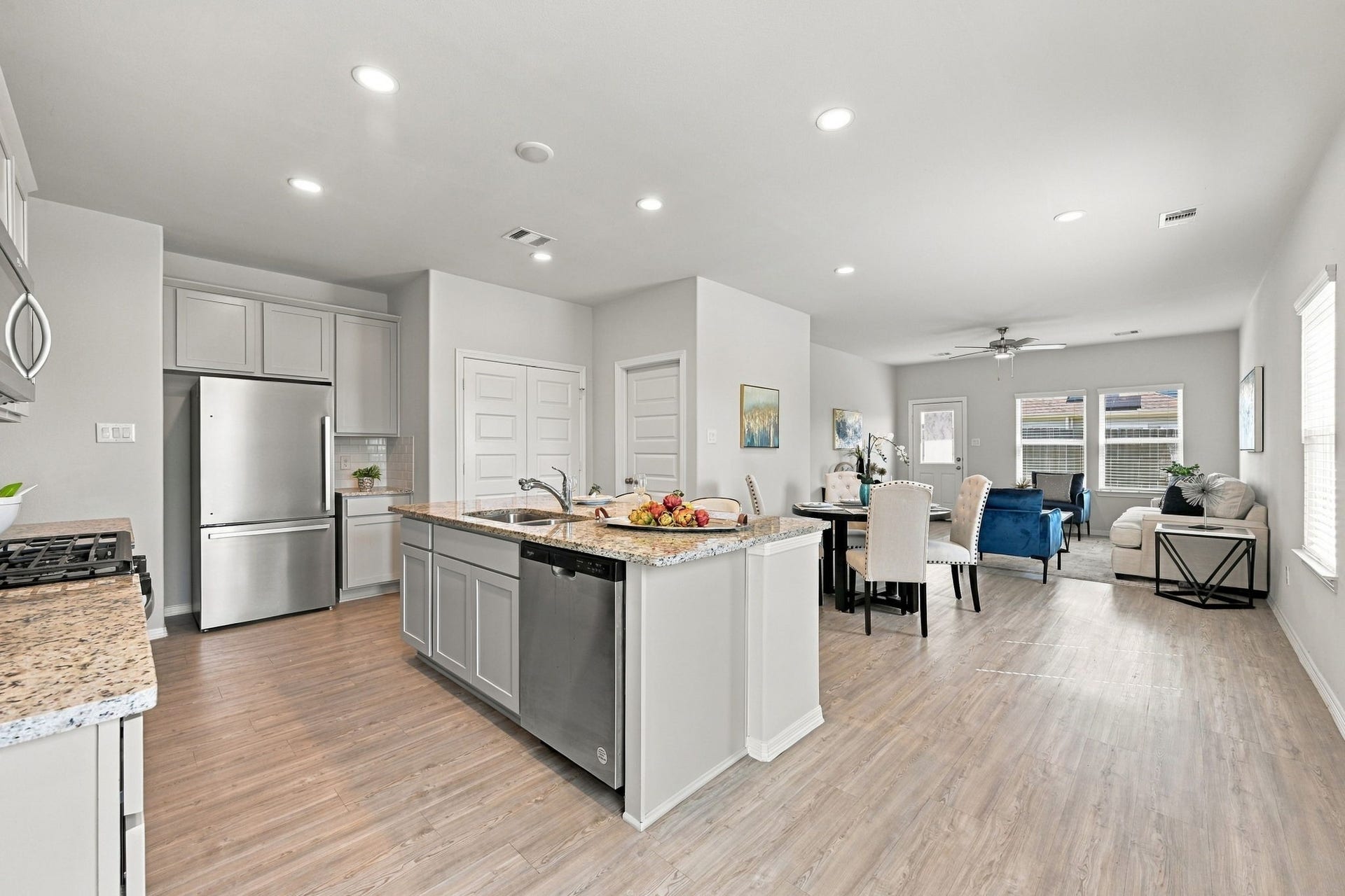 5702 Fresh View Court, Katy, TX 77493 Designed for effortless everyday living, the home's open-concept layout brings together the spacious kitchen, adjoining dining area, & inviting family room. High ceilings, abundant recessed lighting, & continuous wood-look flooring create a cohesive design that feels both spacious & welcoming.
