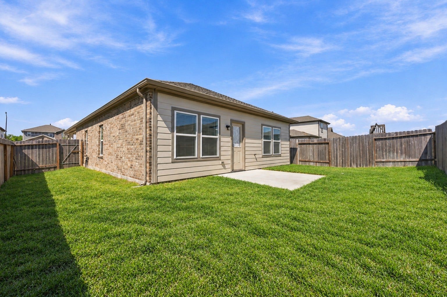 5702 Fresh View Court, Katy, TX 77493 Step outside to discover a fully fenced backyard featuring a spacious grassy lawn & an open concrete patio just beyond the back door. Whether enjoying a quiet morning outdoors, grilling on the weekends, or creating a comfortable seating area, this inviting space offers plenty of possibilities. *Grass has been edited.