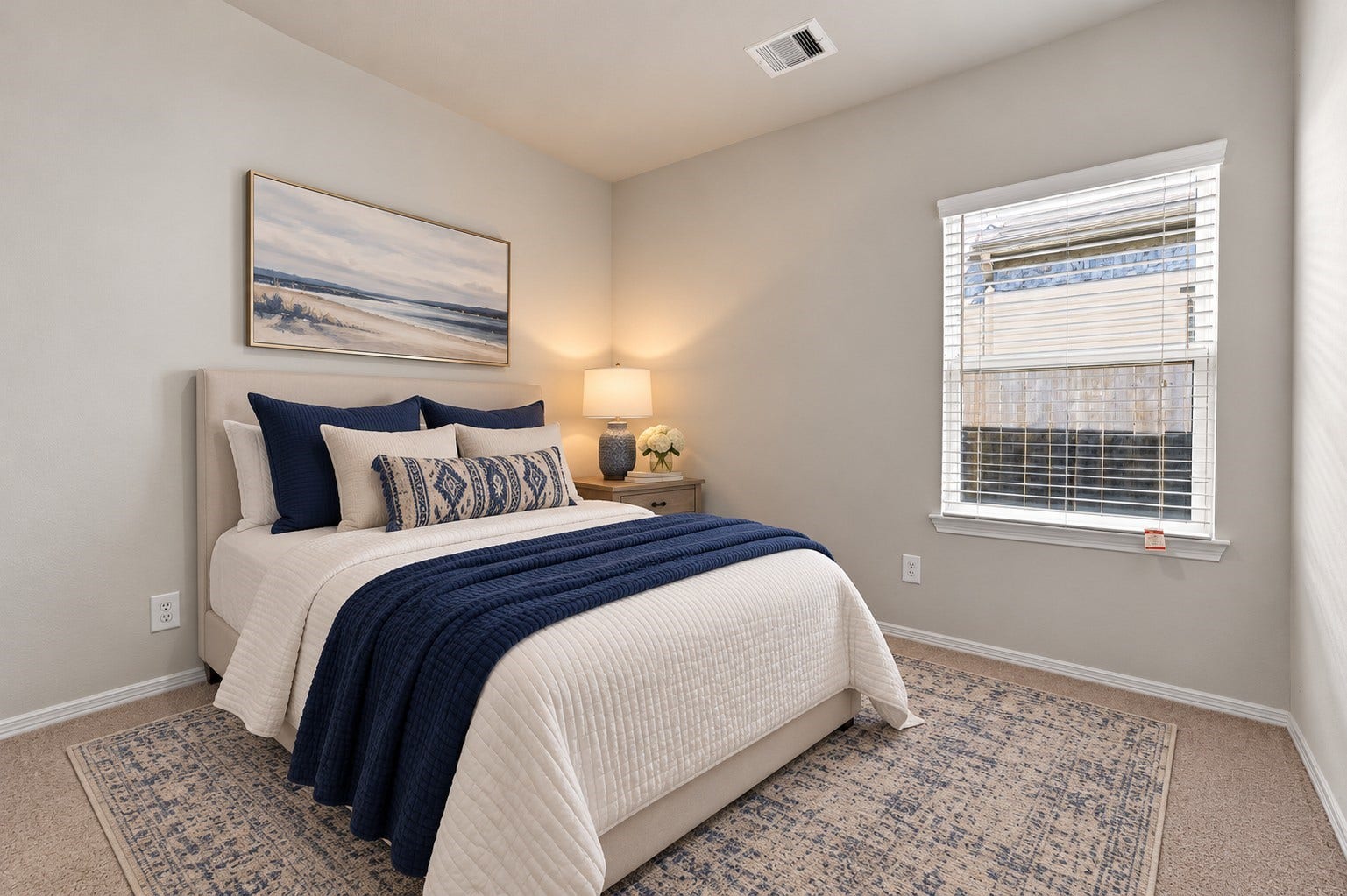 5702 Fresh View Court, Katy, TX 77493 Beautifully presented, this secondary bedroom offers a cozy yet sophisticated setting with soft neutral walls, comfortable carpeting, & a large window accented by white blinds. *This photo has been virtually staged.