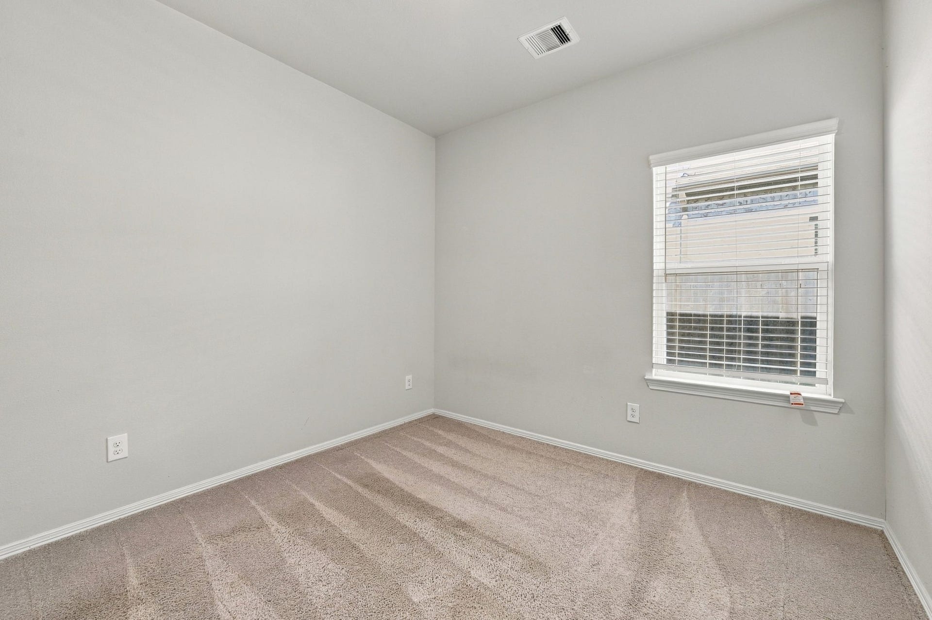 5702 Fresh View Court, Katy, TX 77493 Natural light filters through the bedroom window, illuminating the soft neutral finishes & plush carpeting. The simple, versatile design makes it easy to personalize the space with your preferred furnishings, colors, & decorative touches.