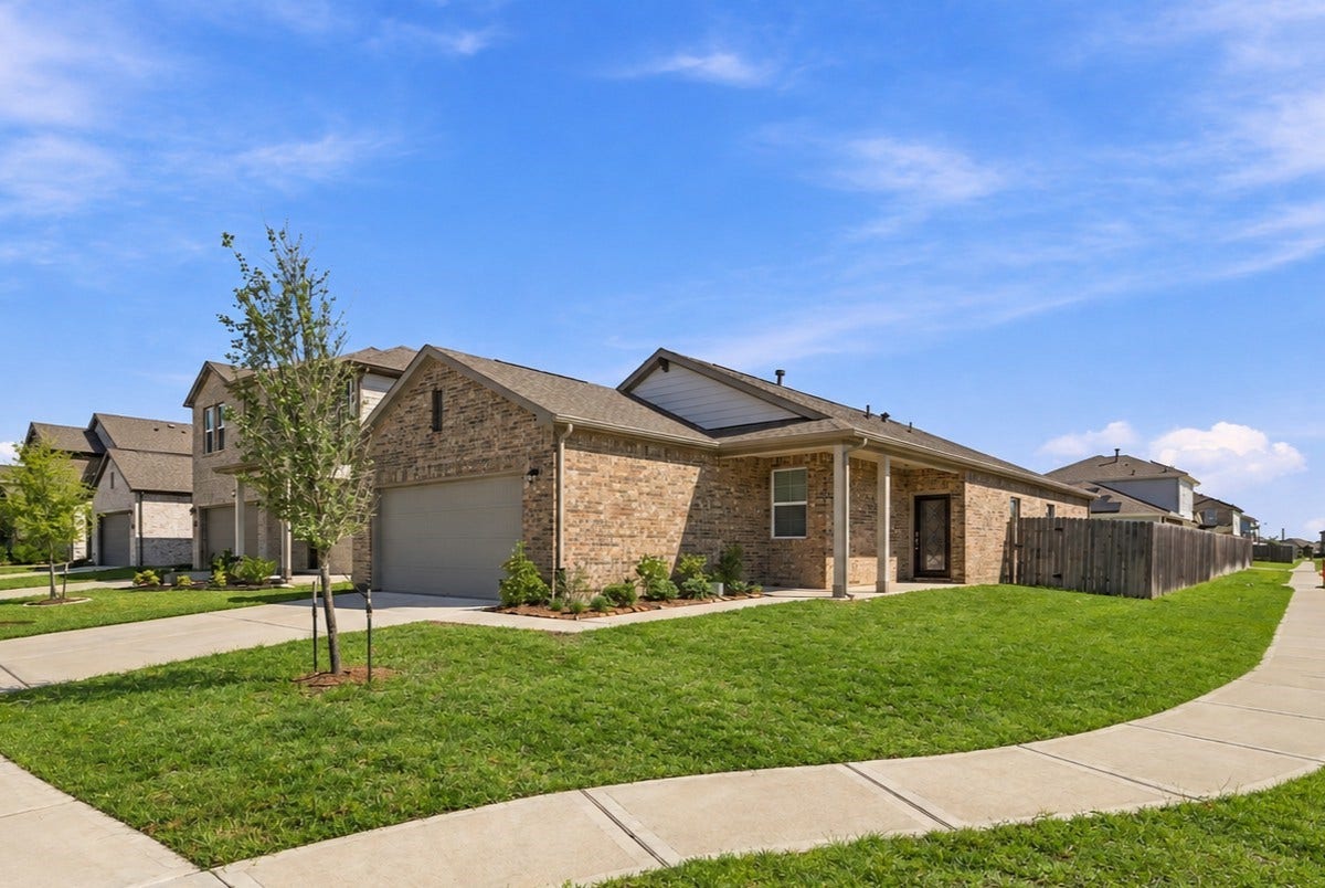 5702 Fresh View Court, Katy, TX 77493 Positioned on a desirable corner lot, this home enjoys an open setting with a generous lawn & added curb appeal. One of the community lakes is within walking distance, offering a scenic destination for a leisurely stroll close to home. *Grass has been edited.