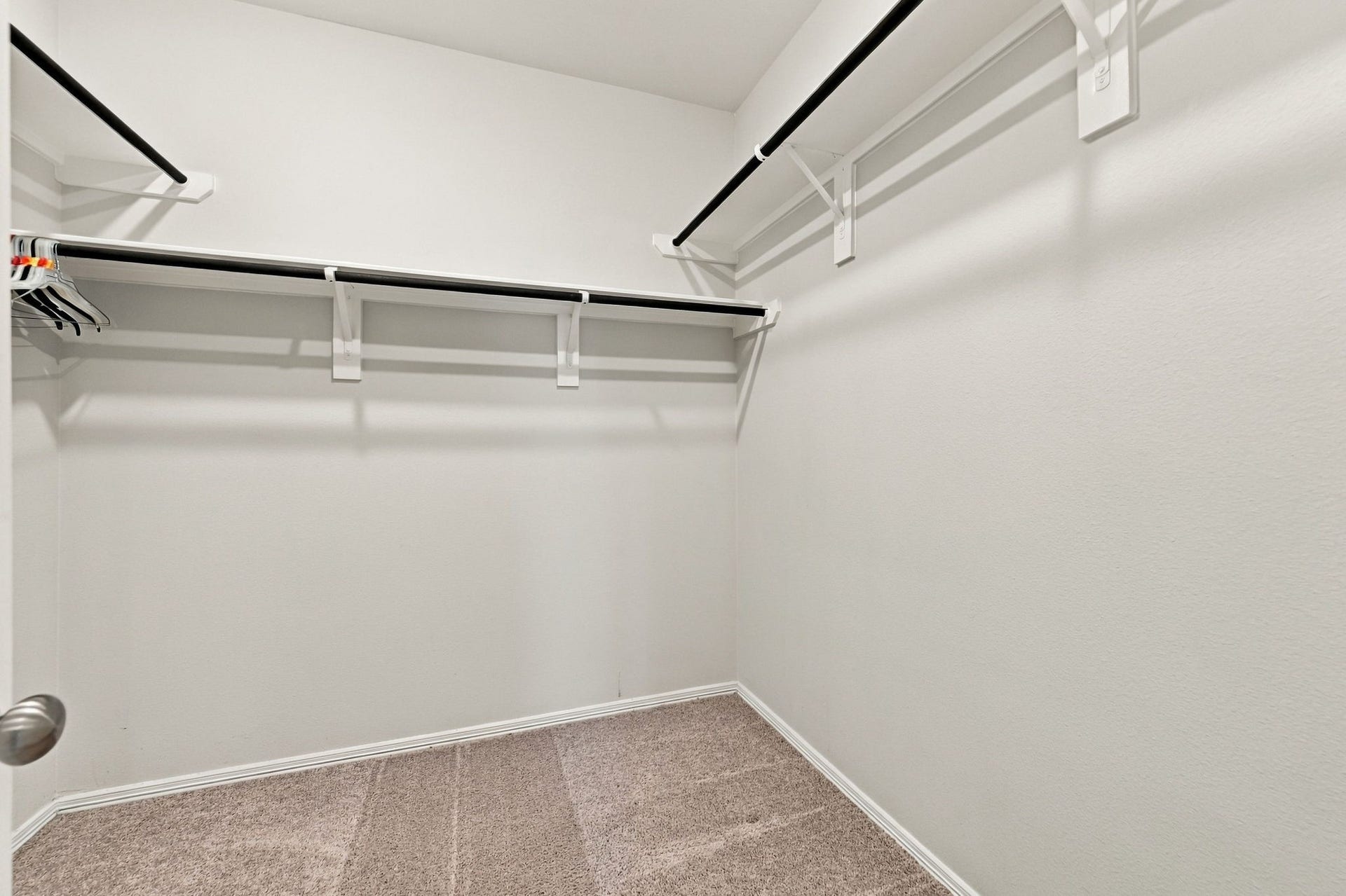 5702 Fresh View Court, Katy, TX 77493 Completing the impressive primary suite is a generously sized walk-in closet with extensive hanging space & overhead shelving. Thoughtfully arranged storage along multiple walls provides plenty of room for clothing, shoes, & accessories, making everyday organization simple & convenient.