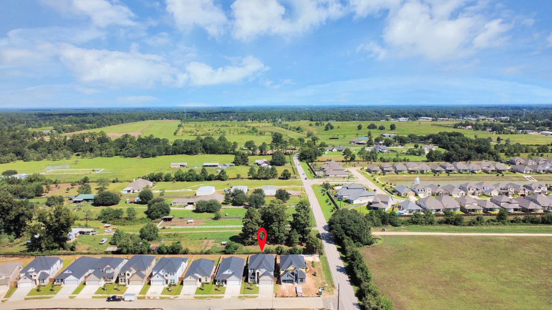26395 Viva Drive, Magnolia, TX 77355 An aerial view of a spacious subdivision lot, highlighting a well-maintained yard and a fully fenced perimeter, offering both privacy and expansive outdoor space.