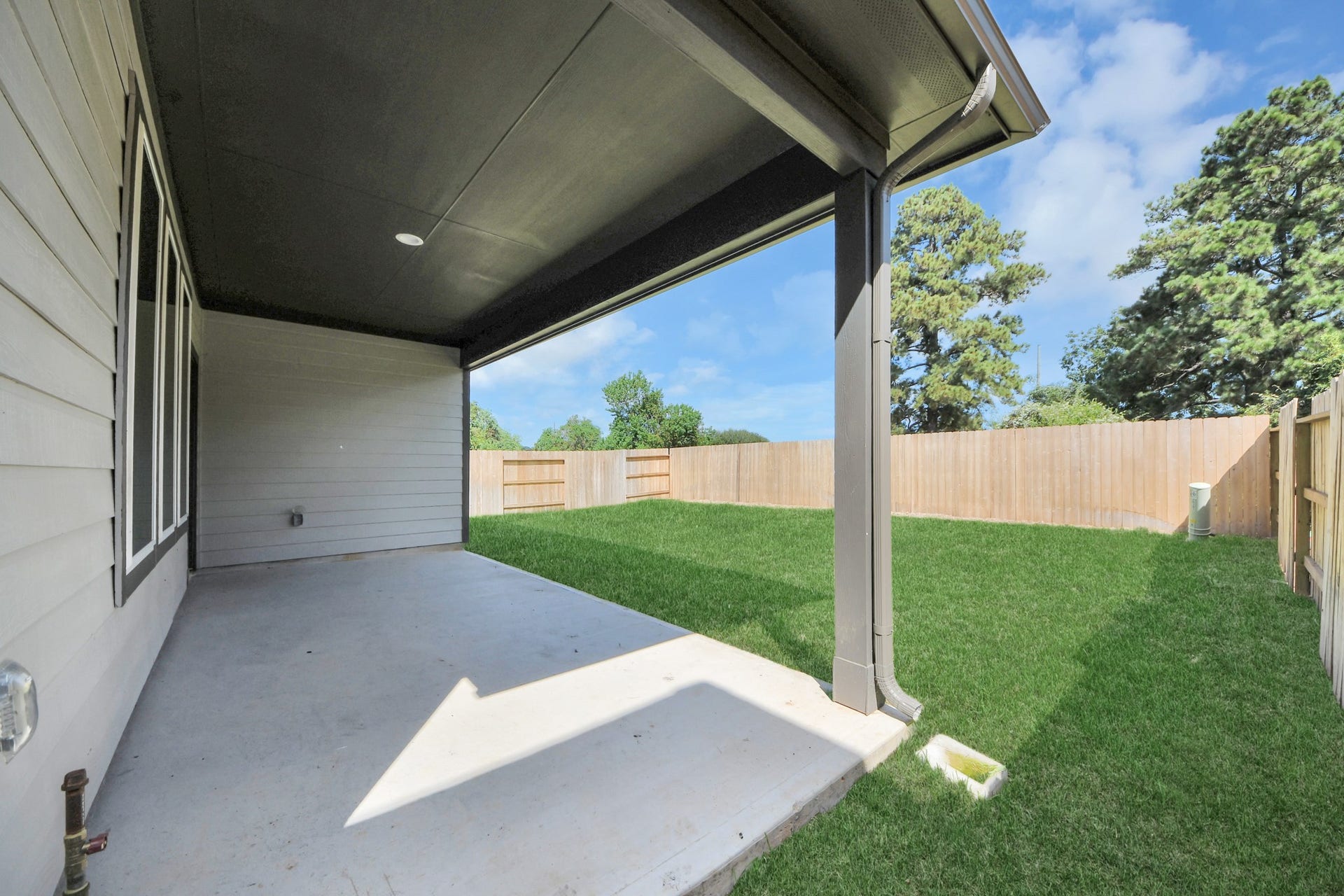 26395 Viva Drive, Magnolia, TX 77355 Experience outdoor living at its finest on this expansive covered patio, thoughtfully designed for BBQs and delightful outdoor dining