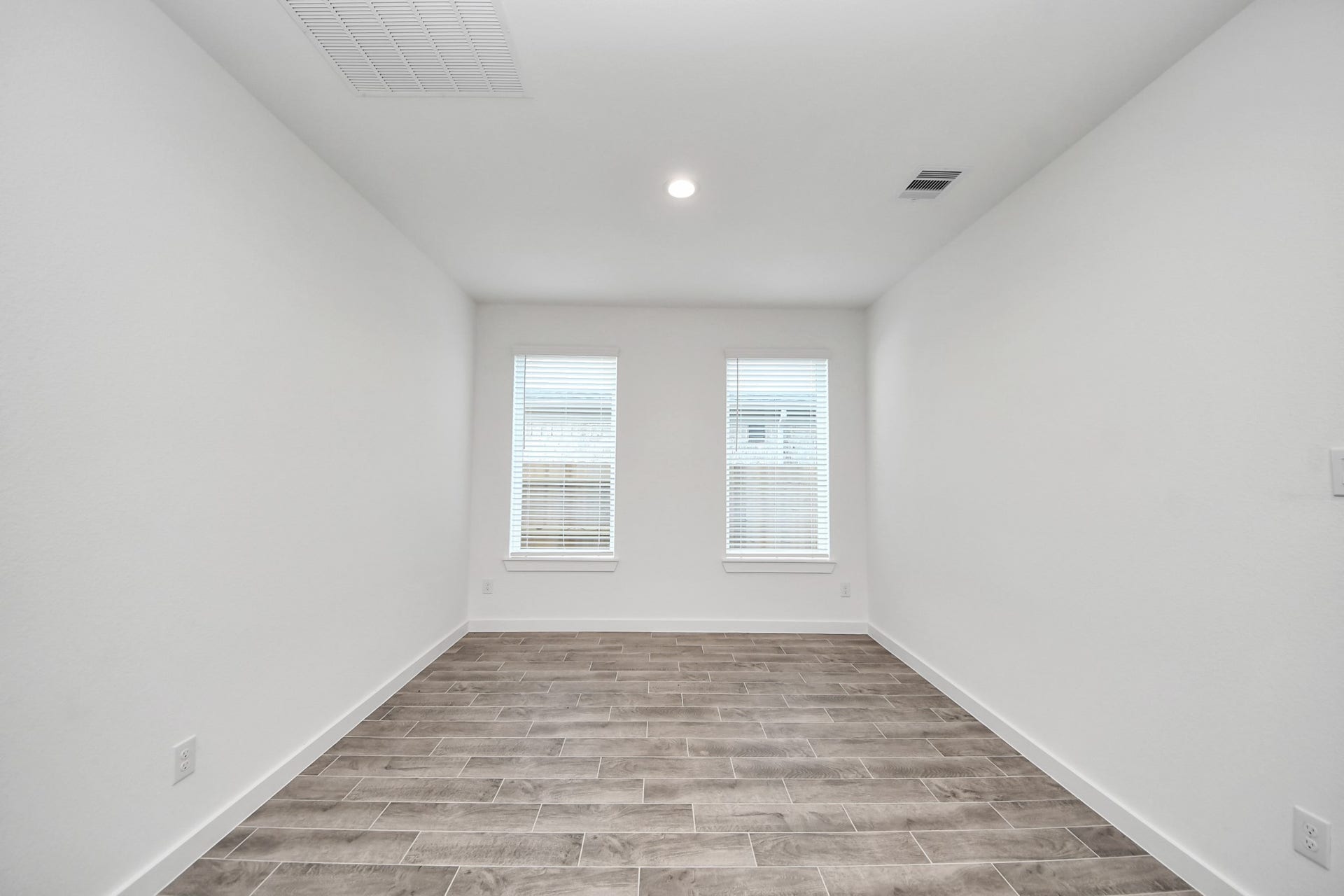 26395 Viva Drive, Magnolia, TX 77355 Create lasting memories with your family and friends at the dining table! This expansive dining room showcases sophisticated flooring, custom paint, and seamlessly connects to the family room and kitchen, providing an open and inviting atmosphere