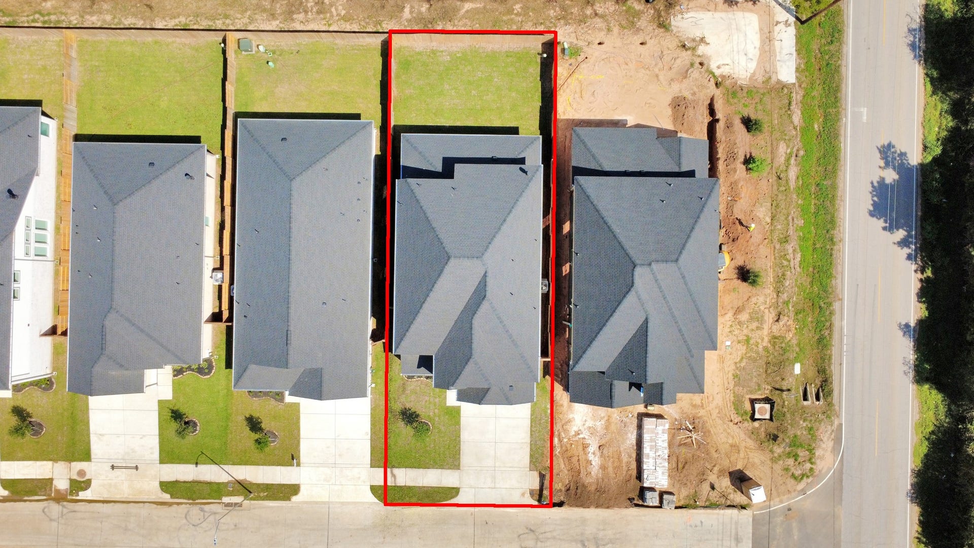 26395 Viva Drive, Magnolia, TX 77355 An aerial view of a spacious subdivision lot, highlighting a well-maintained yard and a fully fenced perimeter, offering both privacy and expansive outdoor space.
