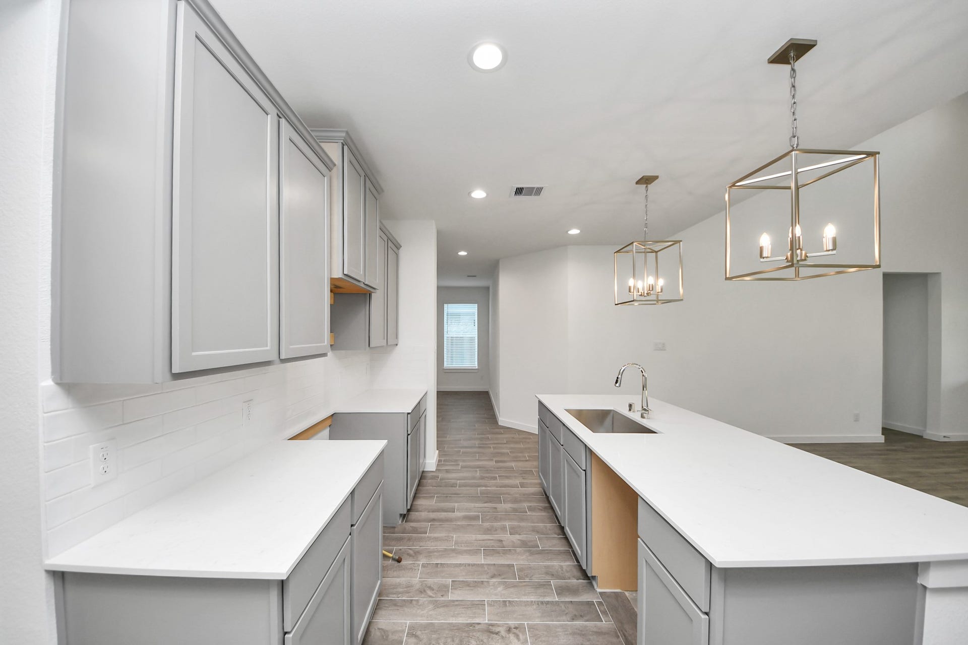 26395 Viva Drive, Magnolia, TX 77355 The extended counter area adds both practicality and style, making meal preparation a breeze. Every detail is thoughtfully designed to enhance the kitchen's functionality and aesthetic appeal.