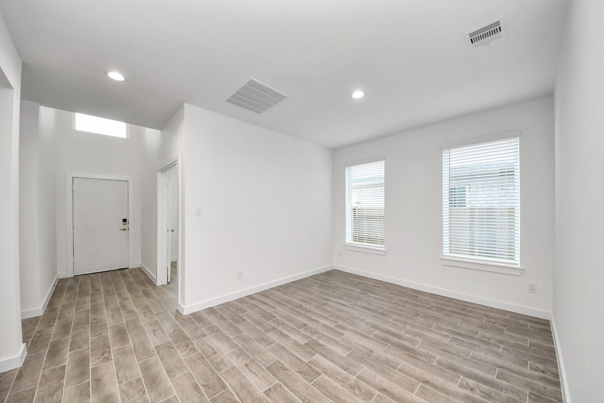 26395 Viva Drive, Magnolia, TX 77355 Make memories gathered around the table with your family and friends! This spacious dining room features elegant flooring, custom paint, and adjacent to family room and kitchen for open concept feel.