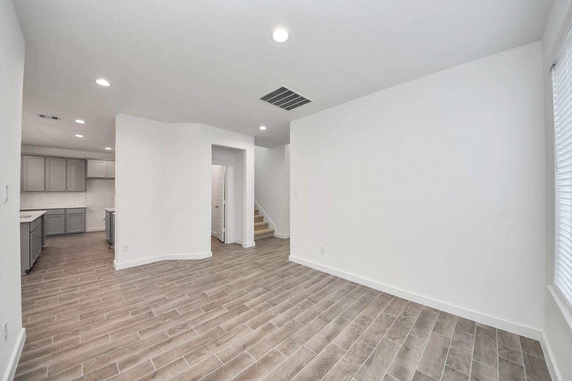 26395 Viva Drive, Magnolia, TX 77355 Craft enduring memories with loved ones around the table! This roomy dining area boasts stylish flooring, personalized paint, and is conveniently situated next to the family room and kitchen, fostering an open and inclusive ambiance.