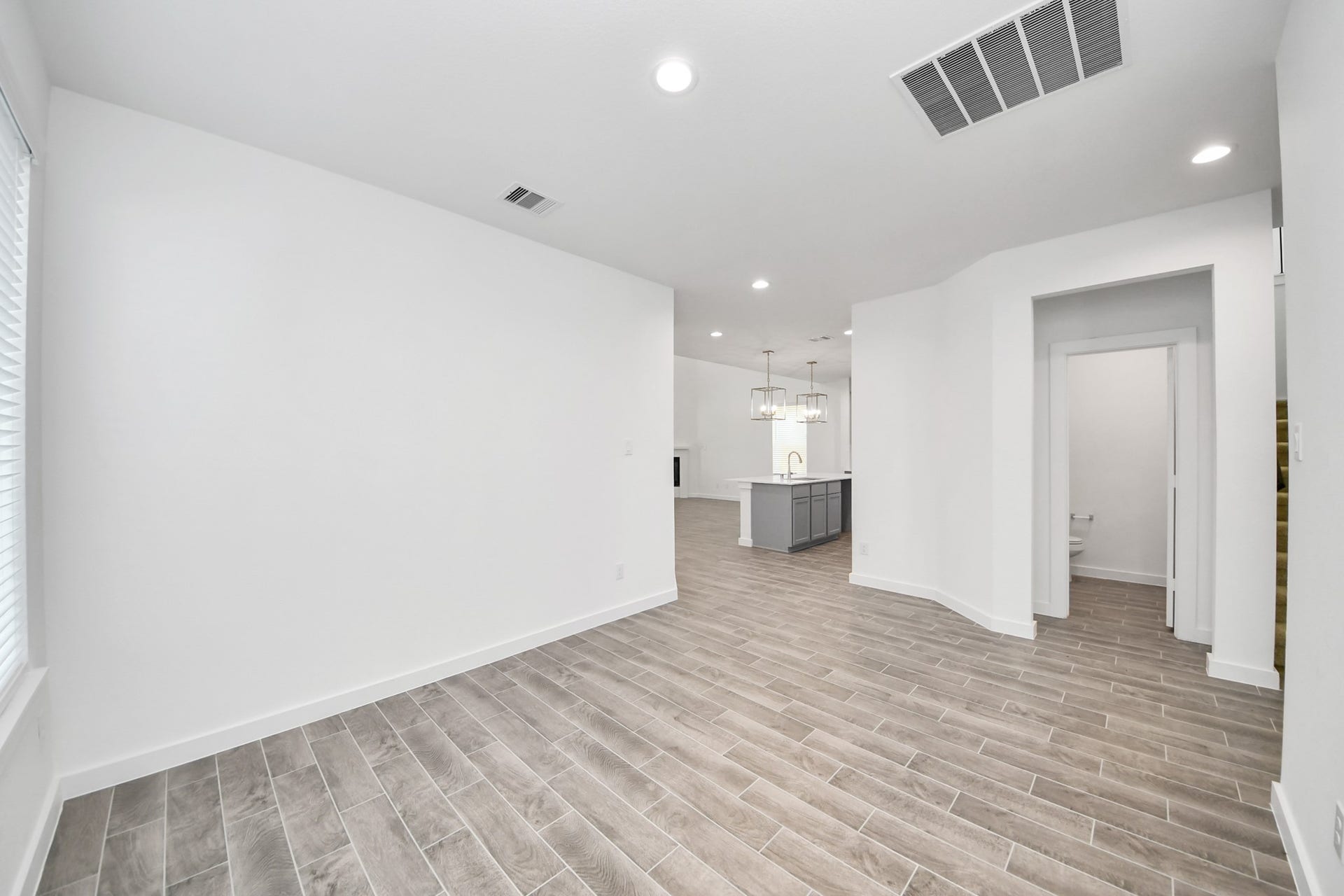 26395 Viva Drive, Magnolia, TX 77355 Craft enduring memories with loved ones around the table in this roomy dining area. It boasts stylish flooring, personalized paint, and is conveniently situated next to the family room and kitchen, fostering an open and inclusive ambiance.