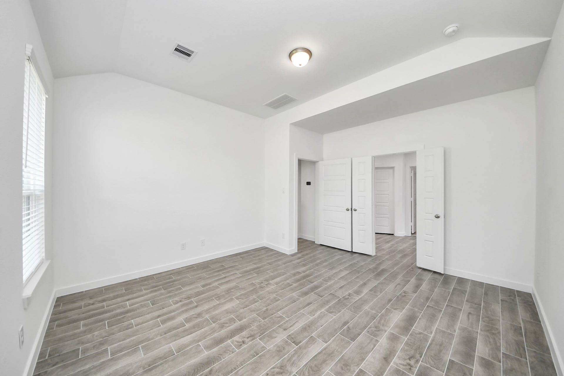 26395 Viva Drive, Magnolia, TX 77355 Escape and relax in the exquisite primary suite, a haven to unwind after a long day.