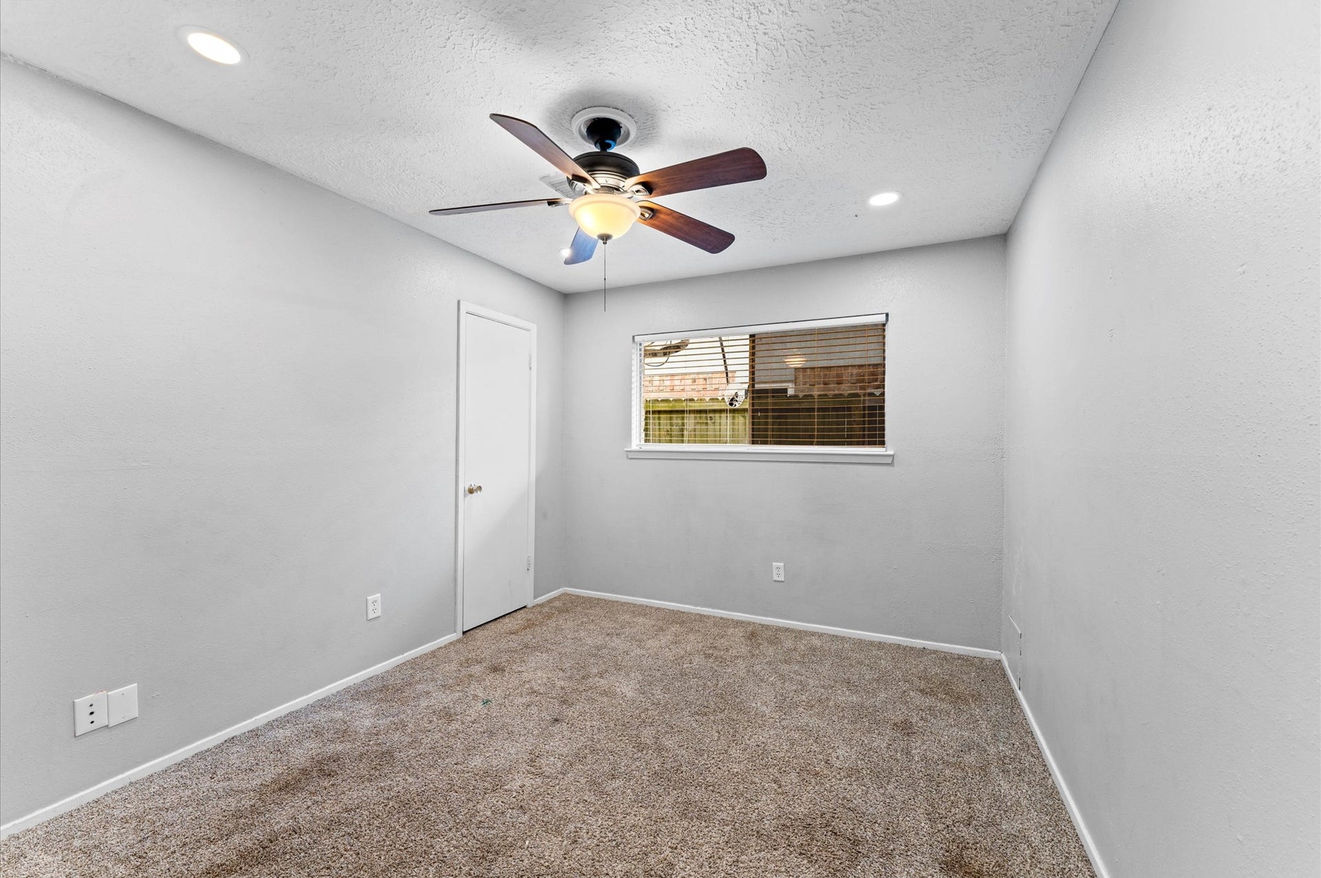 11227 Verlaine Drive, Houston, TX 77065 Bedroom 2 offers a comfortable space for any family member or guest. It also has a walk-in closet.