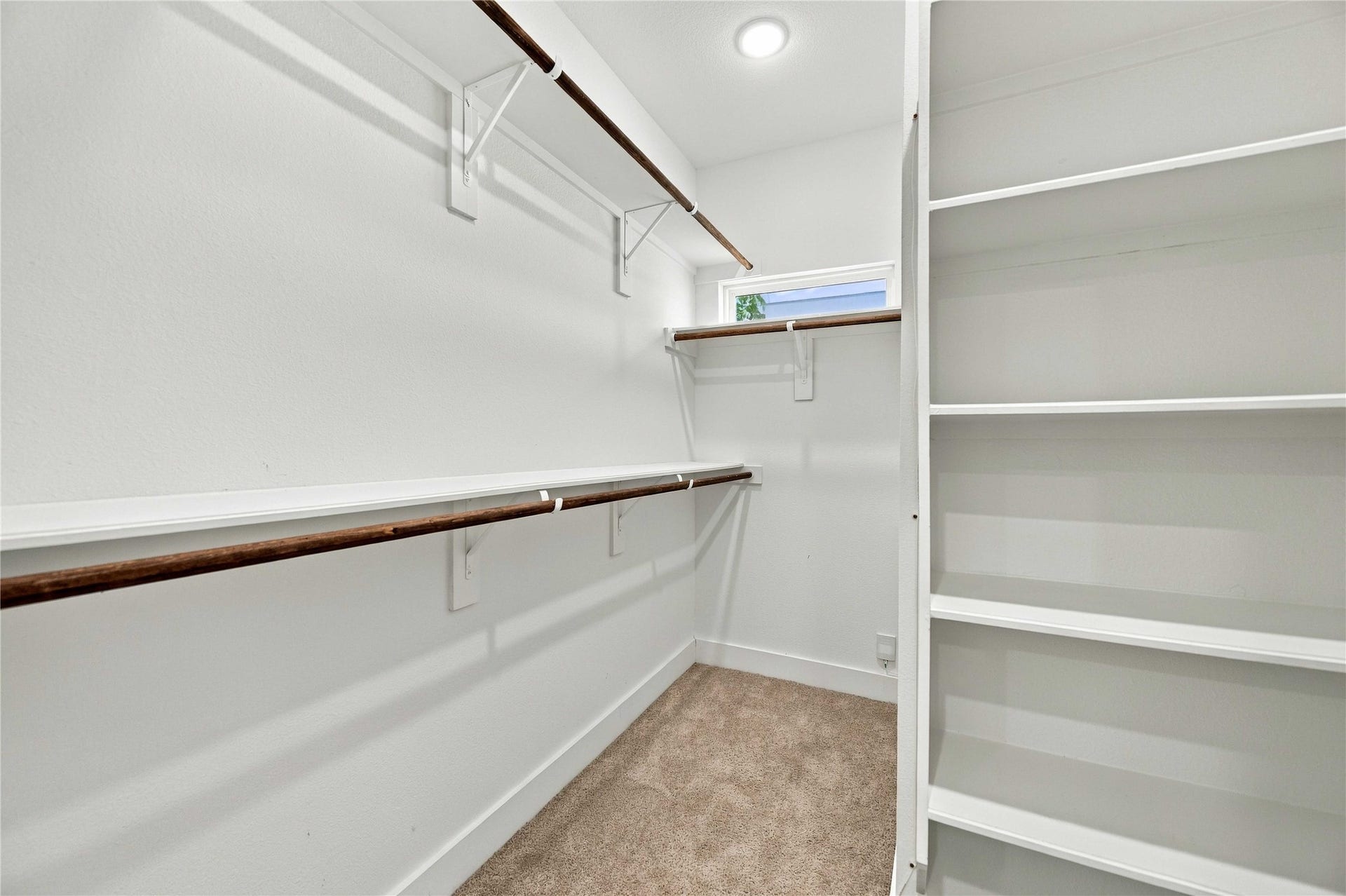 A walk-in closet with room for the wardrobe, the shoes, and the extras-because storage should never be basic.