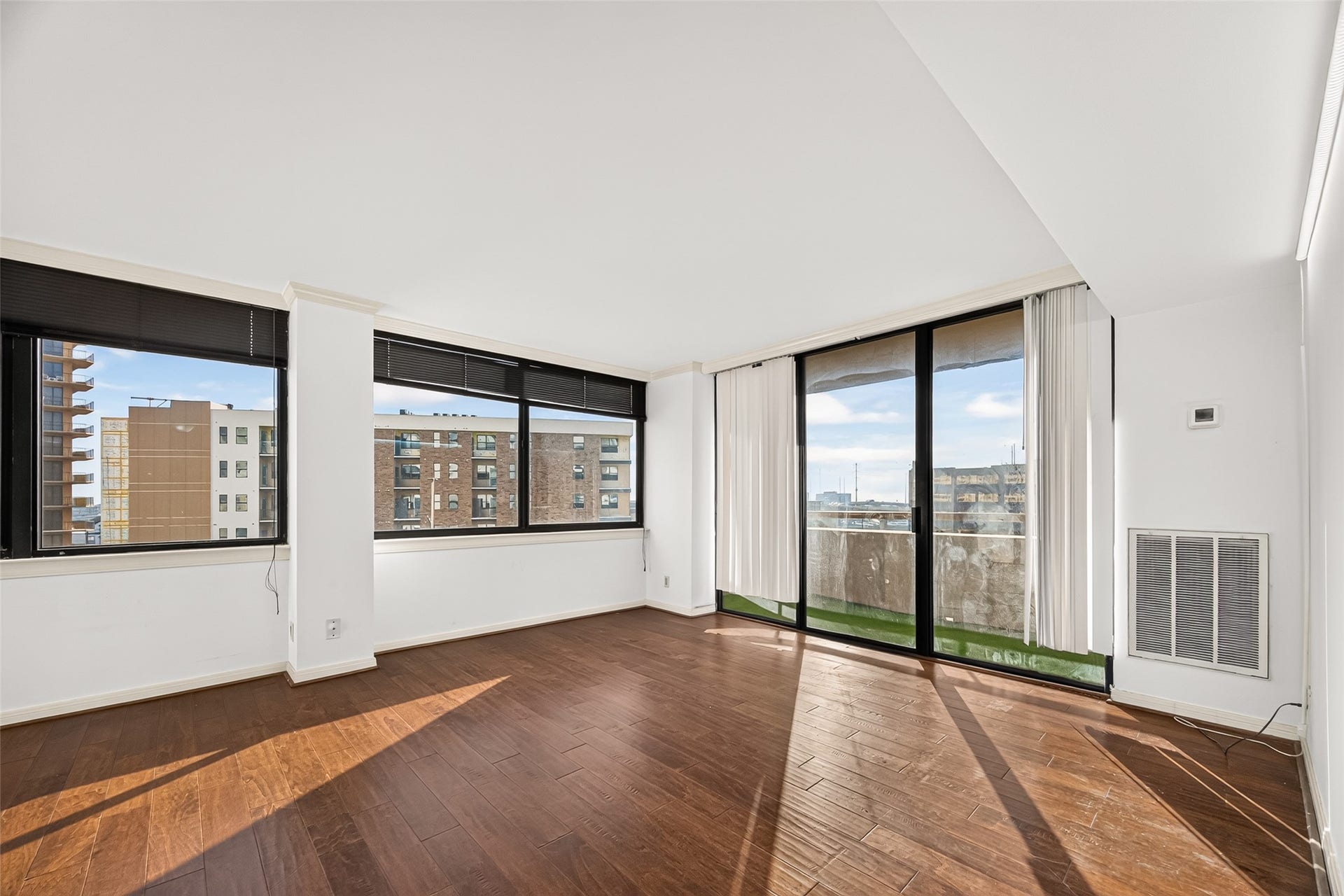 3525 Sage Road, #704, Houston, TX 77056 Spacious living room with engineered hardwood flooring, lots of natural light, beautiful views and your own private balcony!