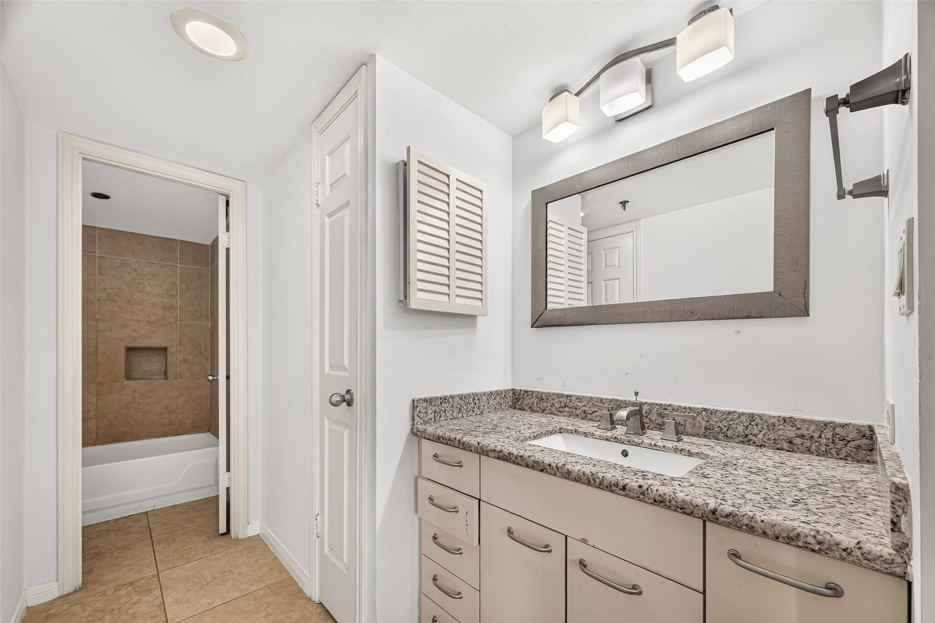 3525 Sage Road, #704, Houston, TX 77056 Primary bathroom with granite counter top, linen closet and walk in closet