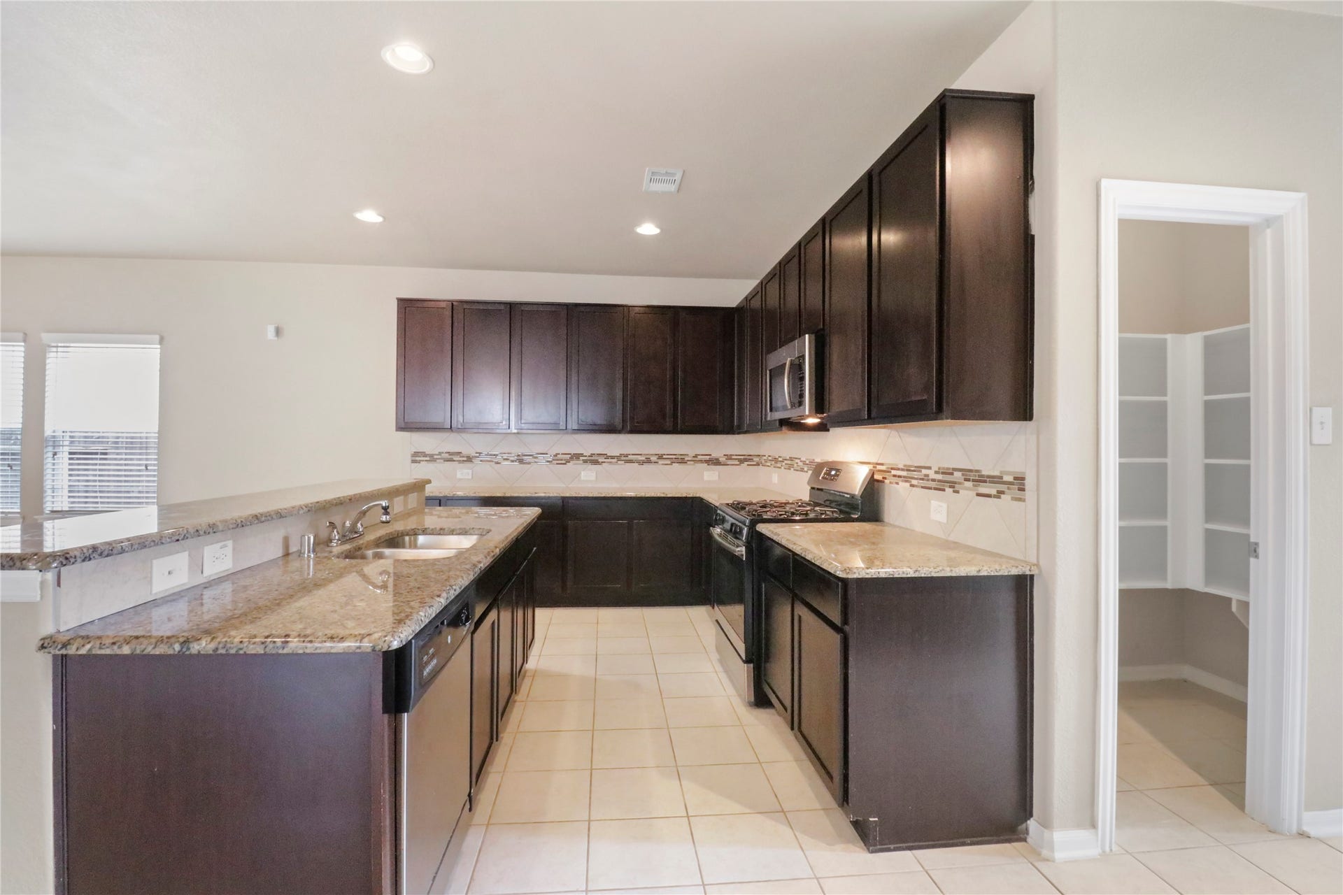 Kitchen with view of pantry