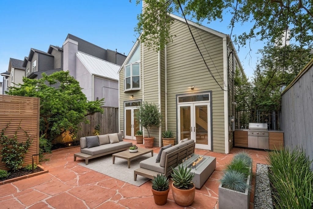 6205 Westcott Street, Houston, TX 77007 Large backyard, digitally staged.