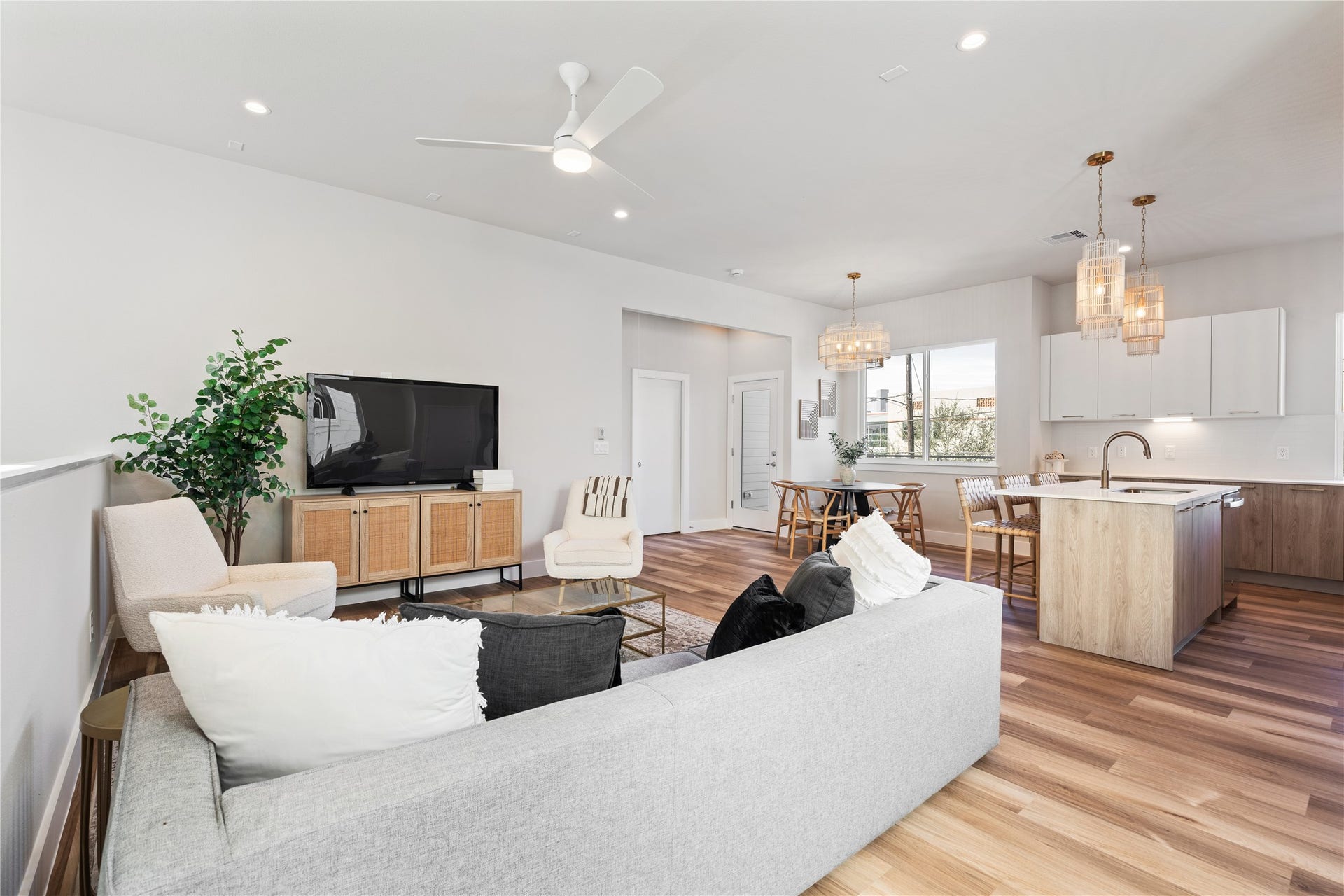 1702 Bringhurst Street, #A, Houston, TX 77020 The living room flows seamlessly into the dining and kitchen spaces, making it easy to host without feeling segmented.