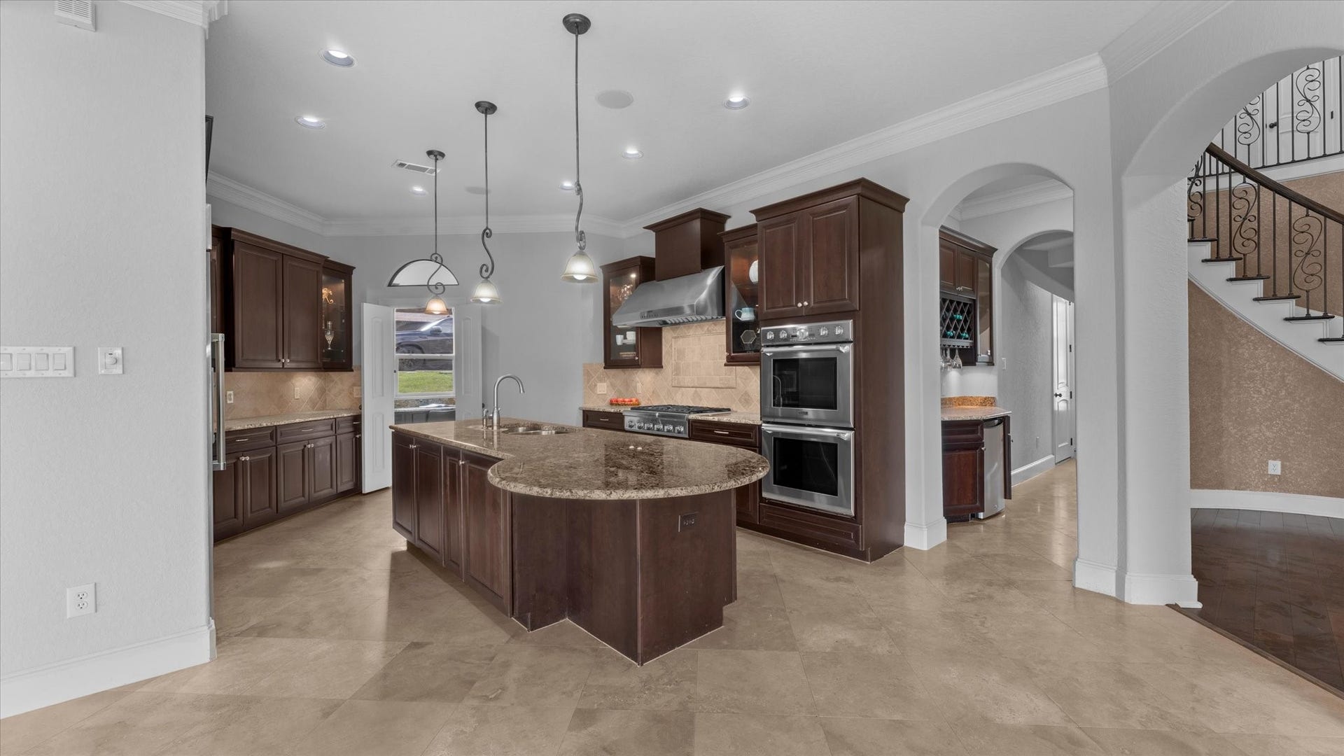 19182 Grandview Point, Montgomery, TX 77356 Chef inspired kitchen with Thermador appliances and double ovens. Through the doors straight ahead is the walk-in pantry.