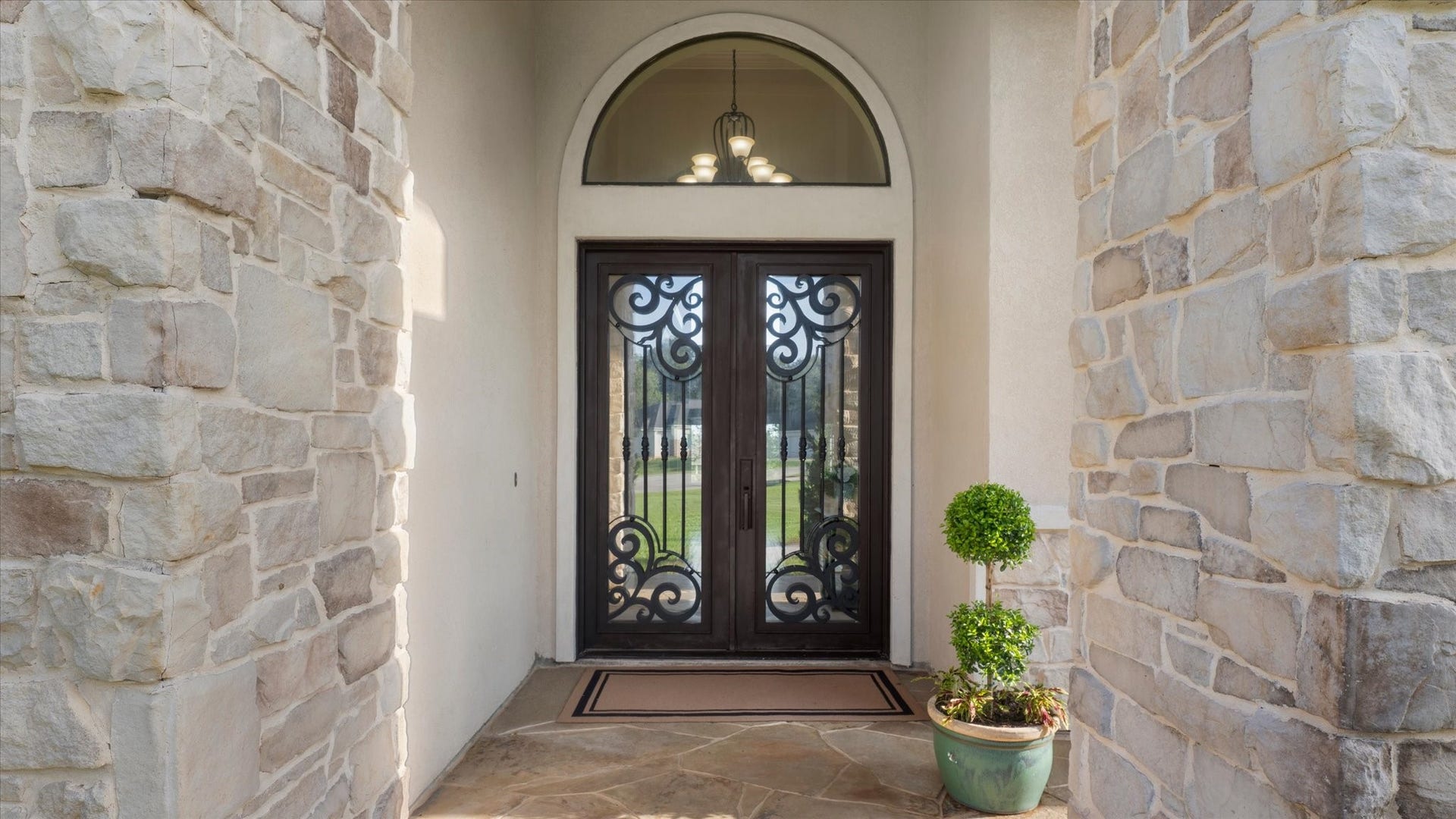 19182 Grandview Point, Montgomery, TX 77356 Forge iron doors measure create an impressive entrance.
