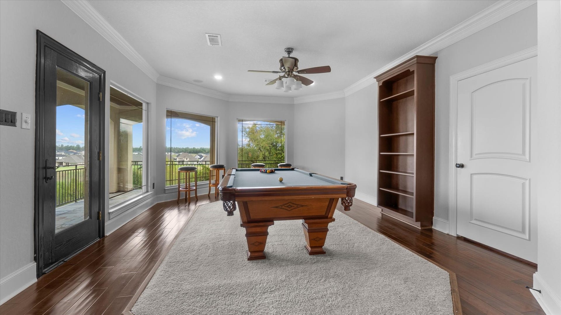 19182 Grandview Point, Montgomery, TX 77356 Gameroom with a fabulous view and an outside attached balcony. To the right is the door to the media room.