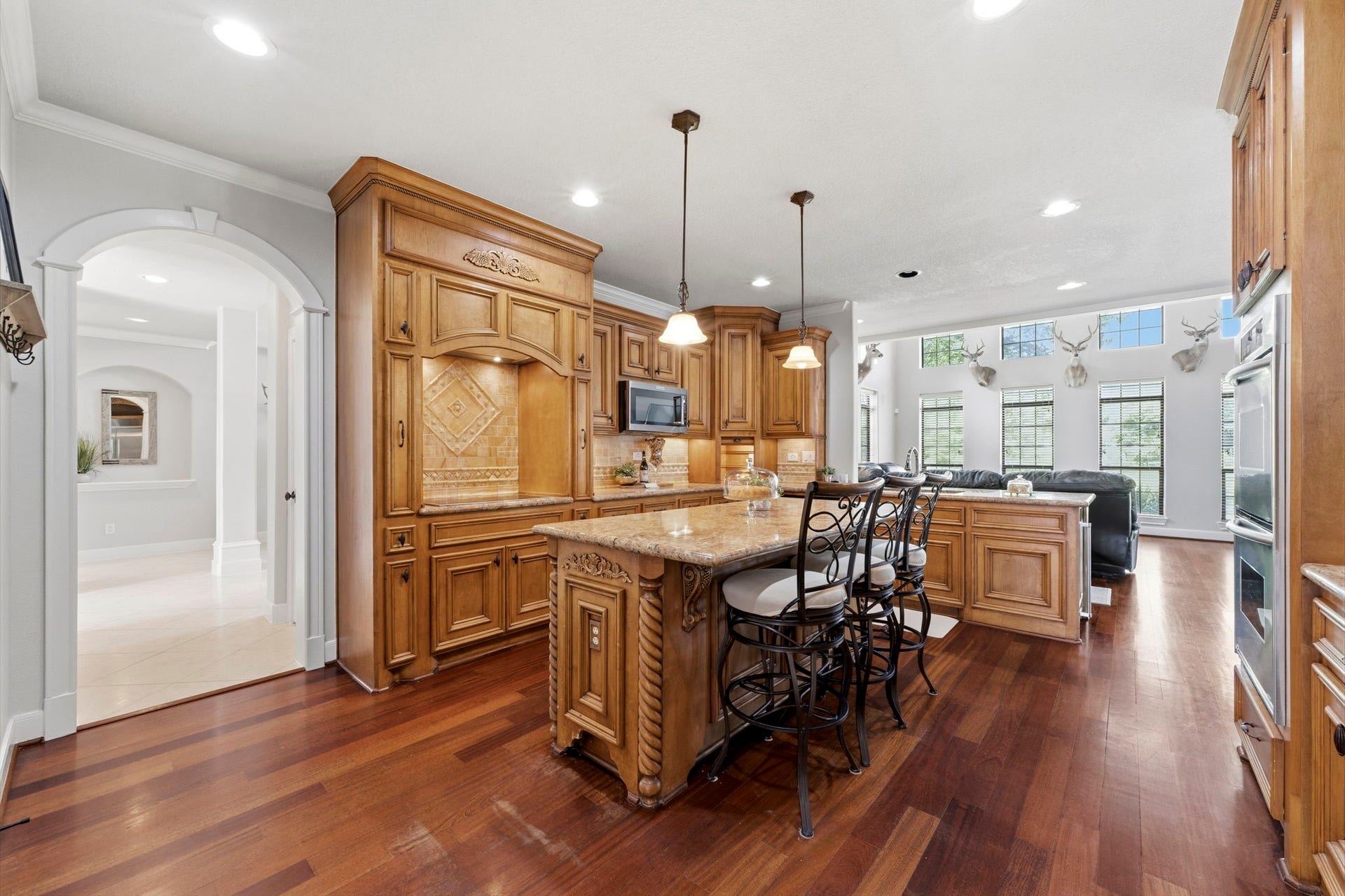 4903 Westerdale Drive, Fulshear, TX 77441 Expansive granite countertops, abundant cabinetry, an oversized island, and a dedicated cooking workspace create a kitchen that's equally suited for weeknight meals and holiday gatherings.