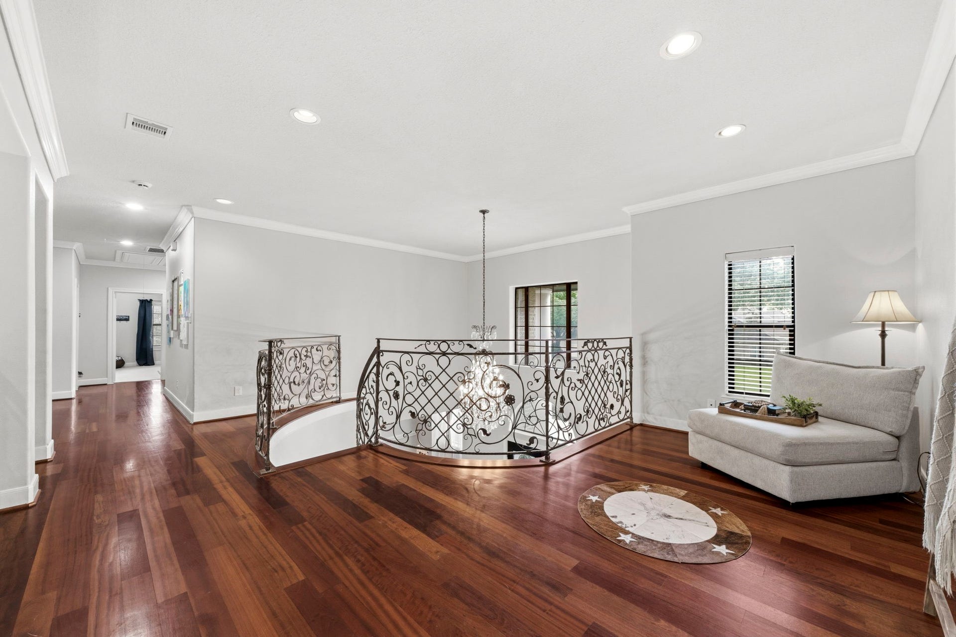 4903 Westerdale Drive, Fulshear, TX 77441 The spacious upstairs landing provides an open connection between the game room and all three upstairs bedroom suites while overlooking the grand foyer below.