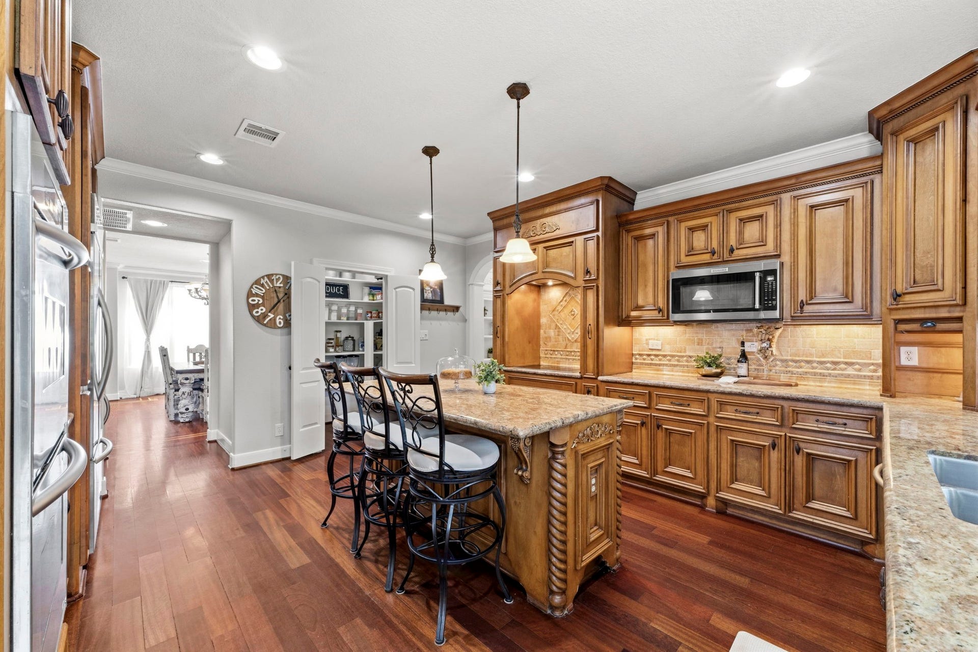 4903 Westerdale Drive, Fulshear, TX 77441 Intricate millwork, furniture-quality cabinetry, decorative corbels, and a substantial center island reflect the exceptional craftsmanship found throughout the home.