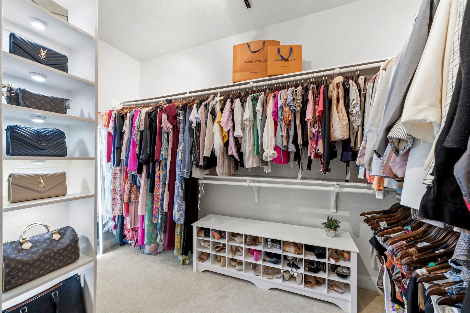 4903 Westerdale Drive, Fulshear, TX 77441 One of two spacious walk-in closets is conveniently located off the primary bath, offering generous hanging space and built-in organization.
