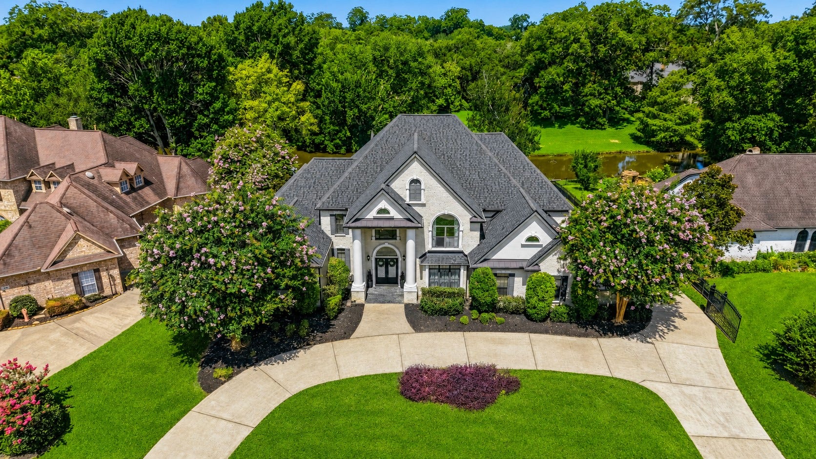4903 Westerdale Drive, Fulshear, TX 77441 Welcome to your custom waterfront estate in the gated golf course community of Weston Lakes.