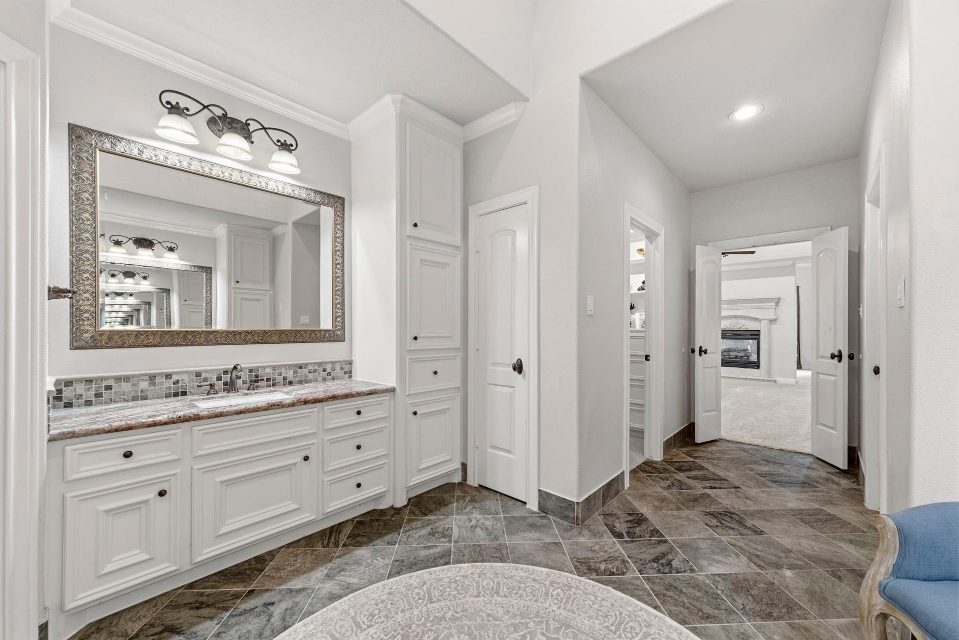 4903 Westerdale Drive, Fulshear, TX 77441 Separate his-and-her vanity areas, abundant cabinetry, and extensive storage make everyday routines both comfortable and convenient.
