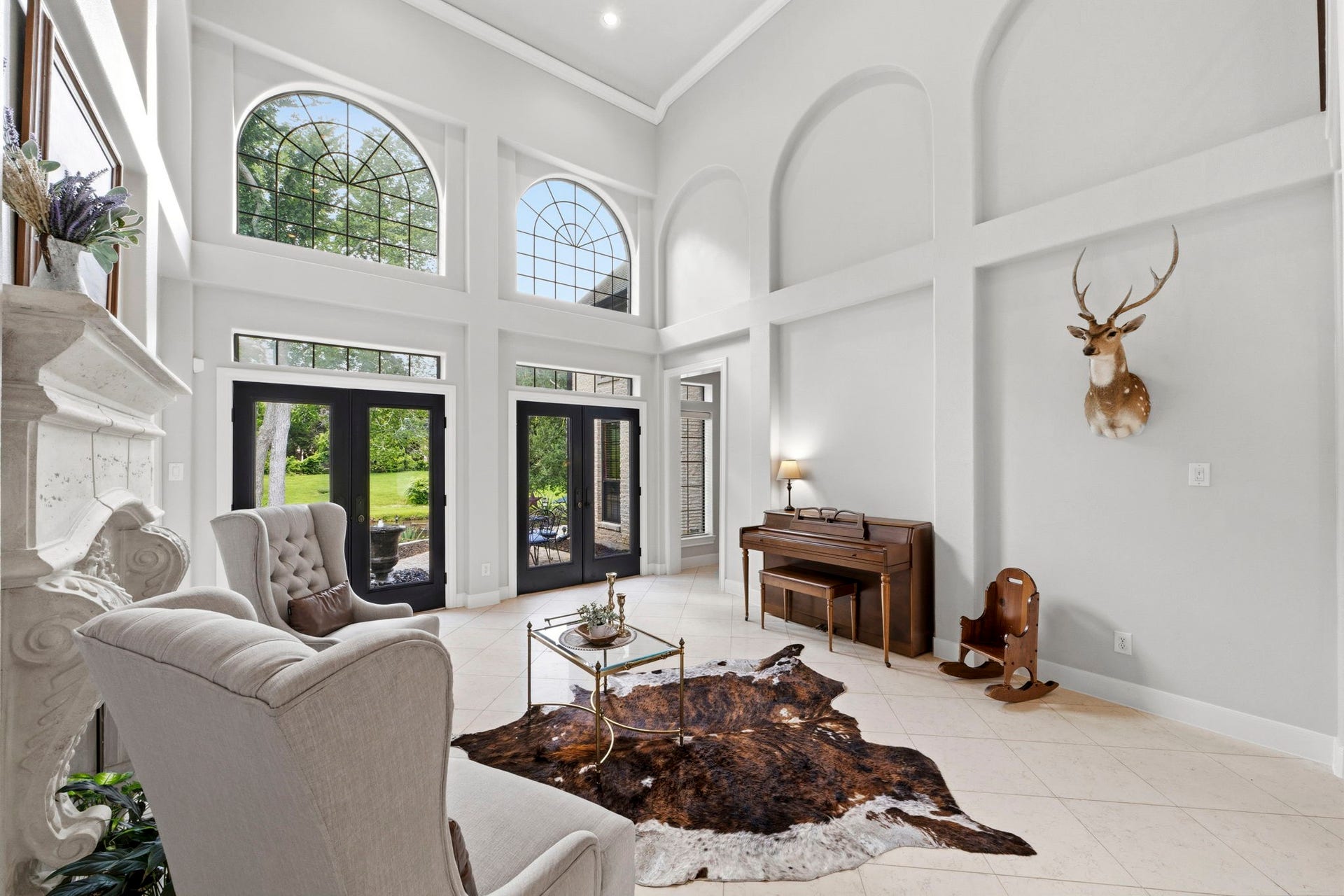 4903 Westerdale Drive, Fulshear, TX 77441 Soaring 18' ceilings and two sets of double doors opening to one of the back patios.