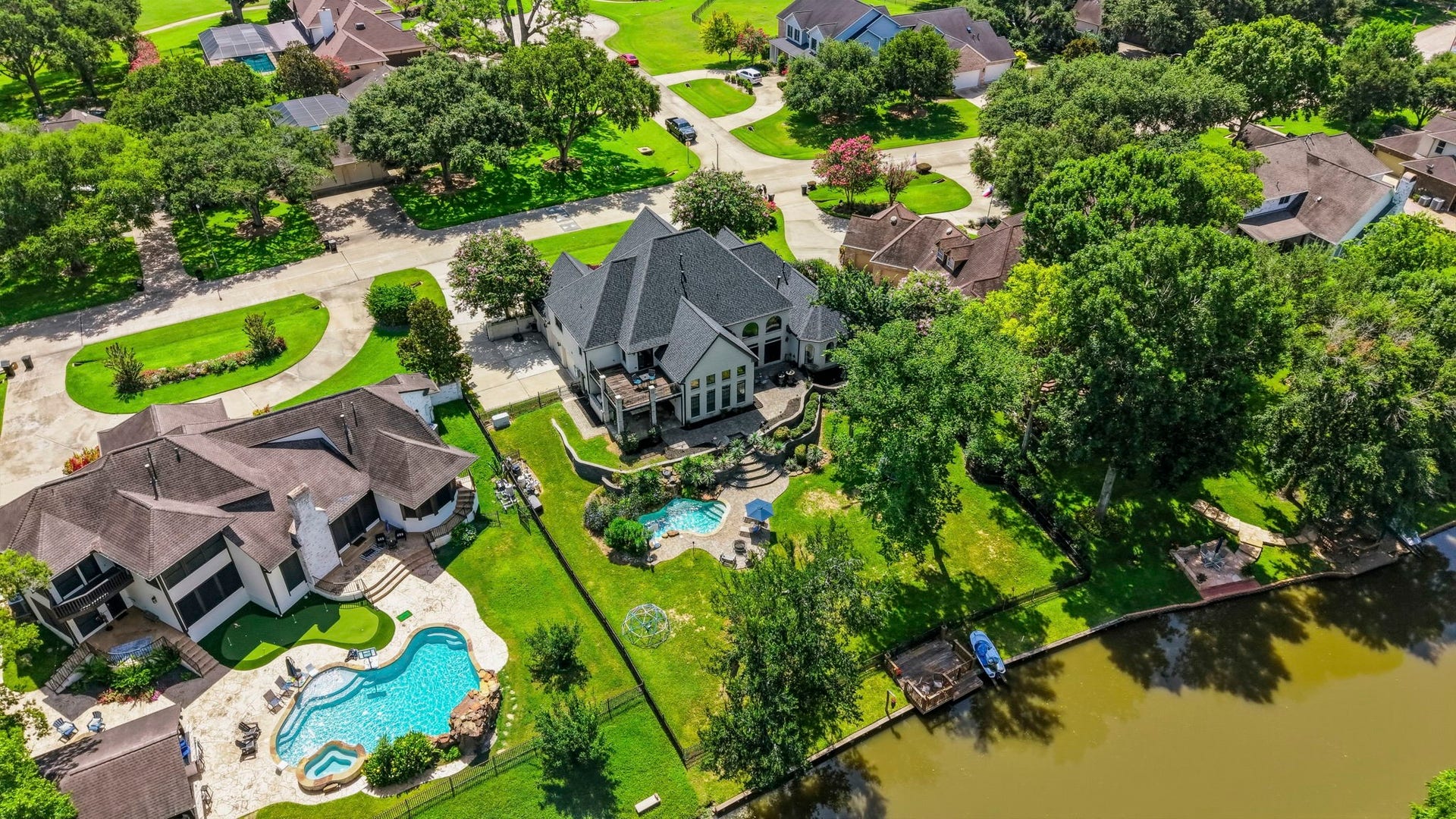 4903 Westerdale Drive, Fulshear, TX 77441 Situated on a .52-acre waterfront lot with 111' of street frontage, this property offers an expansive backyard, private dock, and access to Weston Lakes' interconnected canal and Ox Bow Lake system.