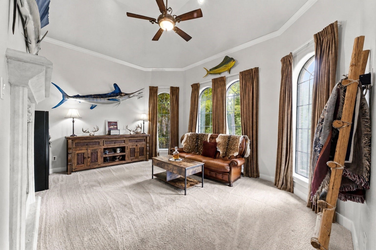 4903 Westerdale Drive, Fulshear, TX 77441 Beyond the double doors, you're welcomed into a spacious flex area that serves beautifully as a sitting room, home office, library, or private retreat, all anchored by a stunning marble fireplace.