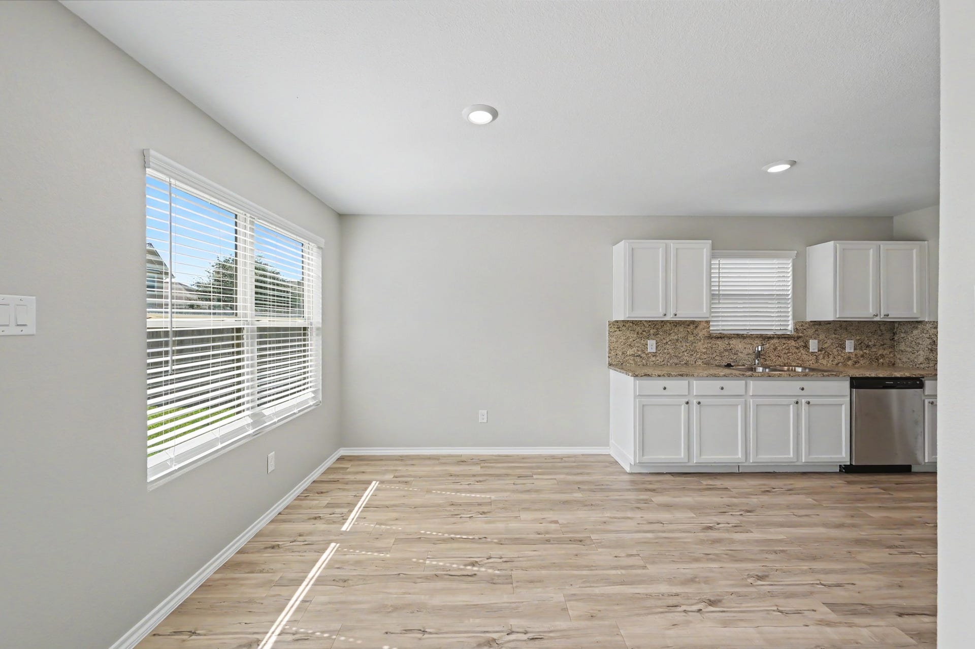 Bright, spacious dining area featuring a large window.