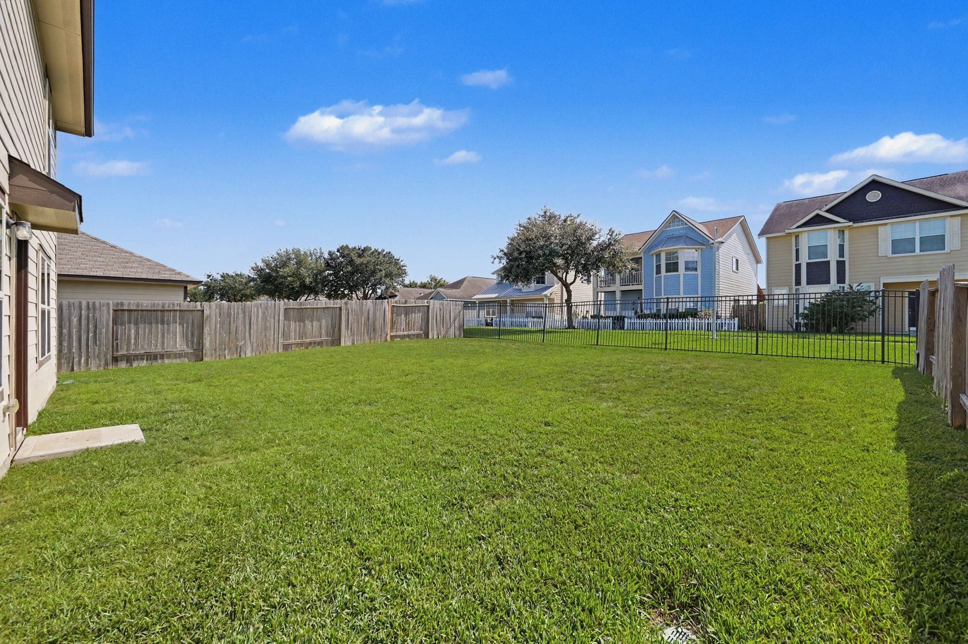 Spacious, fully fenced backyard with plenty of green space for outdoor activities and entertaining, plus no immediate rear neighbors and a walking trail behind the property!