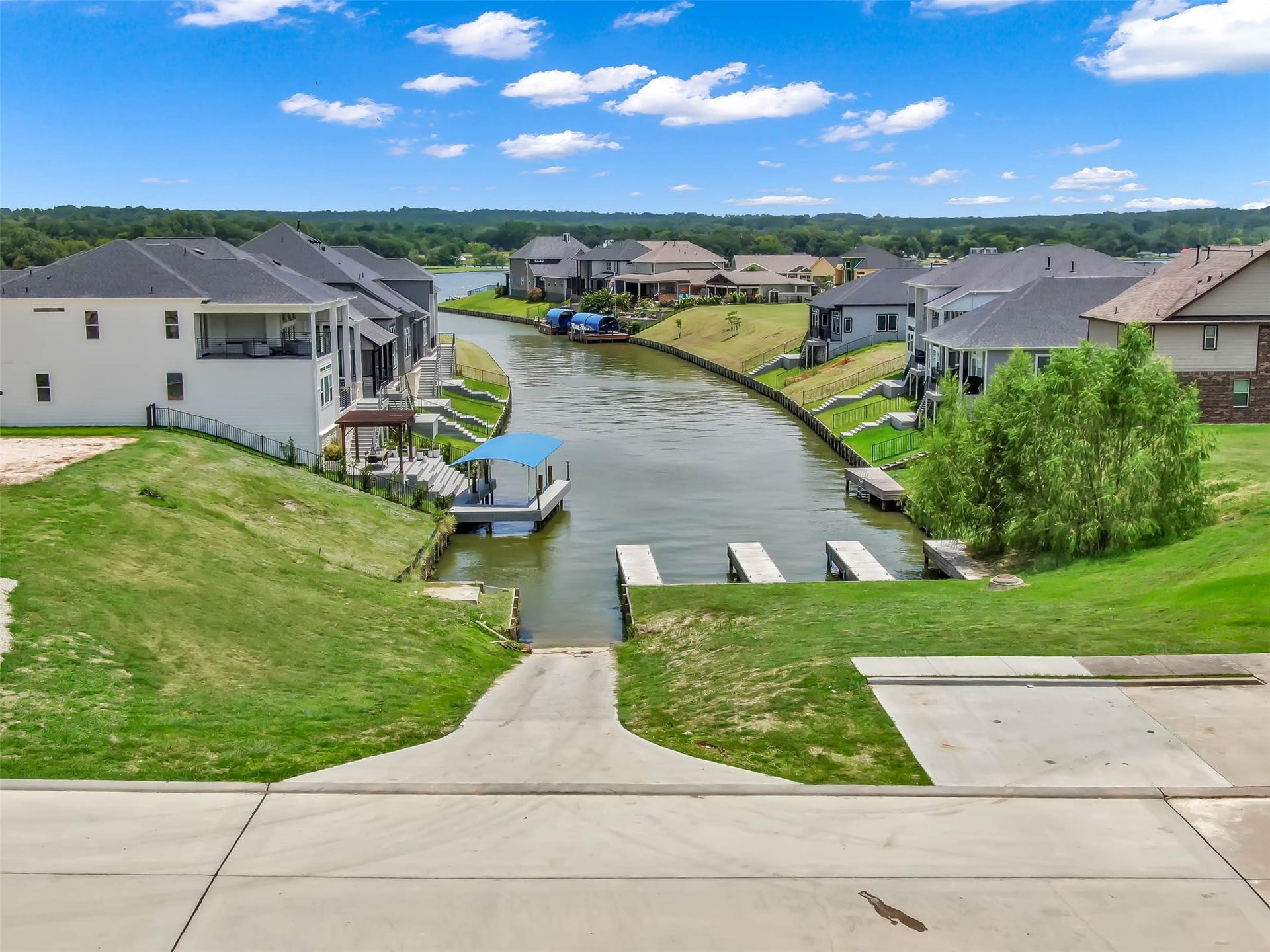 Community boat ramp and docks offering convenient access to Lake Conroe for boating and waterfront recreation.