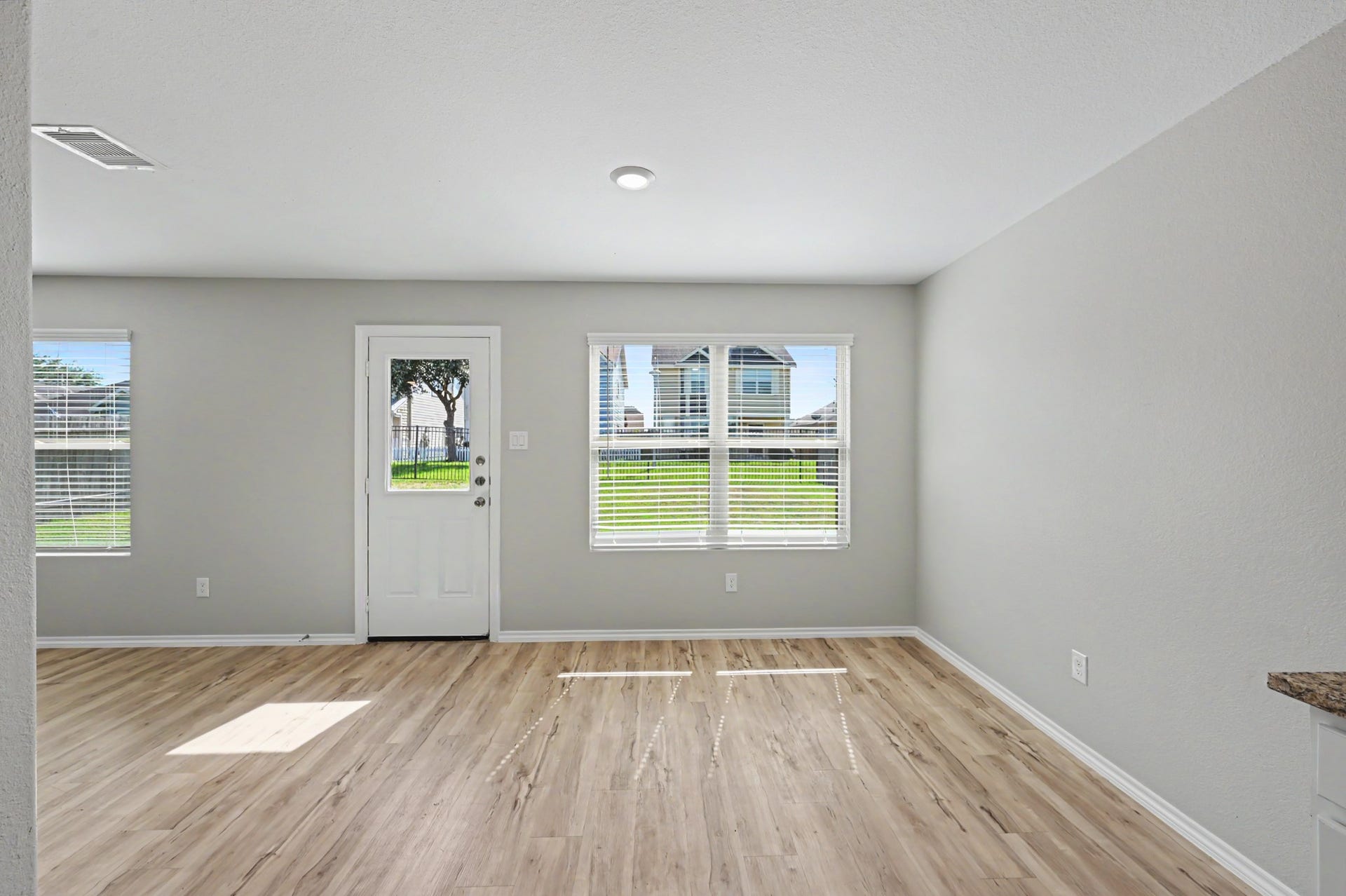 Additional view of dining room with backyard views.
