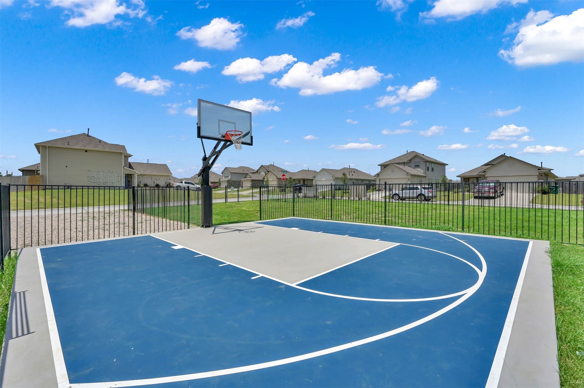 Community basketball court offering a great outdoor space for recreation and fun.
