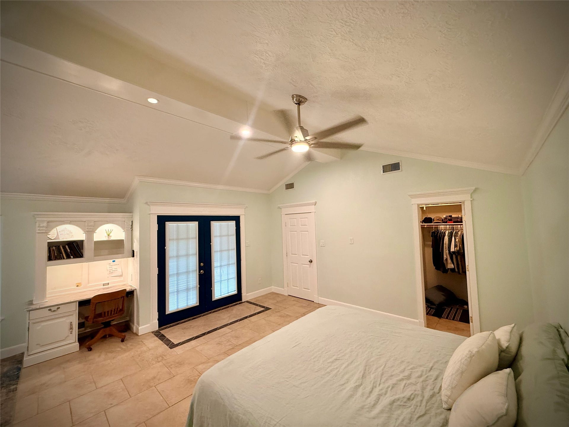 1309 Piney Woods Drive, Friendswood, TX 77546 Primary Suite with doors leading to the back yard