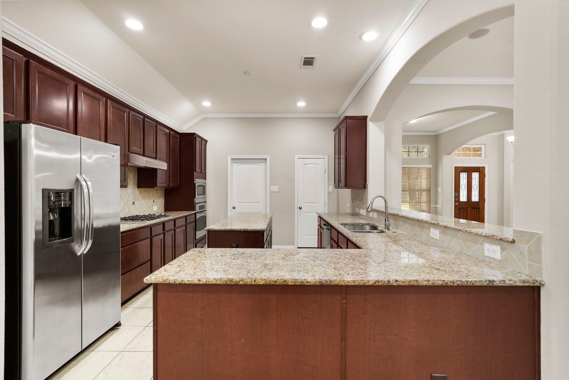314 Trillium Drive, Sugar Land, TX 77479 Convenient kitchen access to the laundry room, attached garage, and walk-in pantry makes daily routines and grocery storage a breeze.