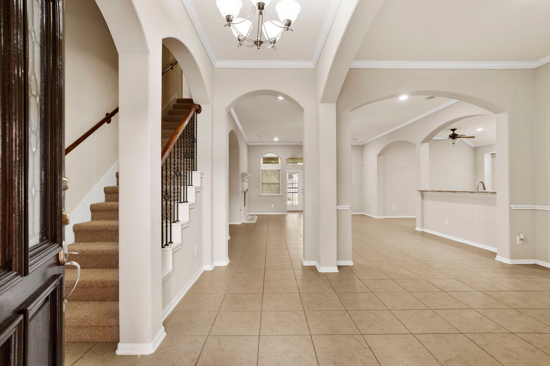 314 Trillium Drive, Sugar Land, TX 77479 Elegant arched entryways add architectural character and timeless charm, creating graceful transitions between rooms and enhancing the homes distinctive design.
