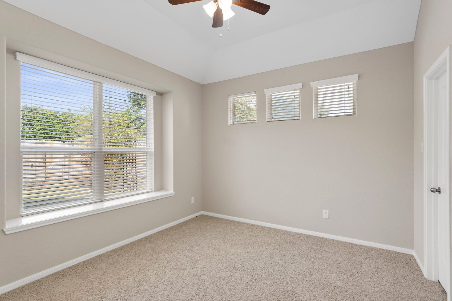 314 Trillium Drive, Sugar Land, TX 77479 Privately tucked away at the back of the home, this delightful bedroom is filled with natural light from an expansive window featuring a deep sill and peaceful views of the backyard.