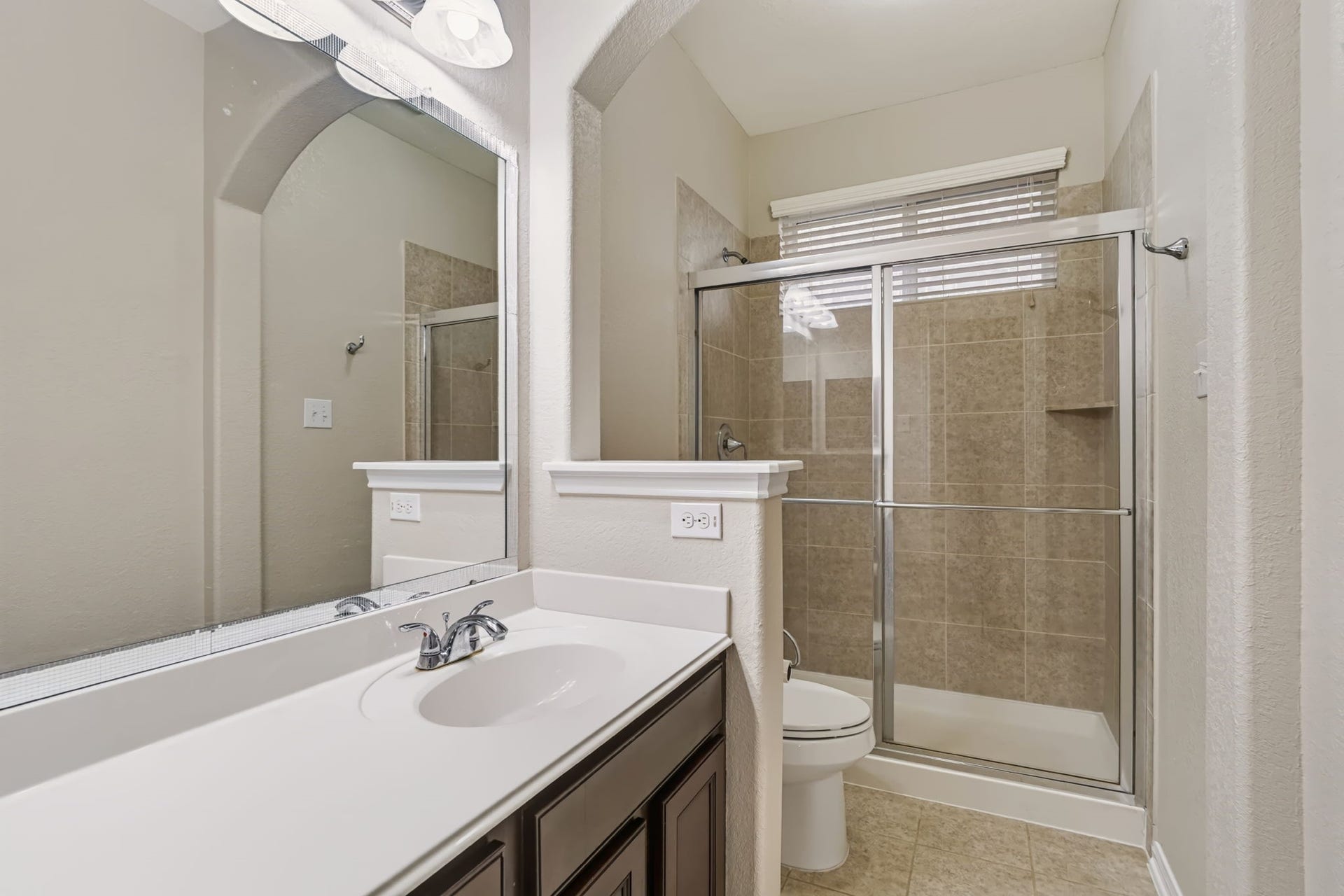 314 Trillium Drive, Sugar Land, TX 77479 Full bathroom with walk-in shower and large vanity featuring extended counter space.
