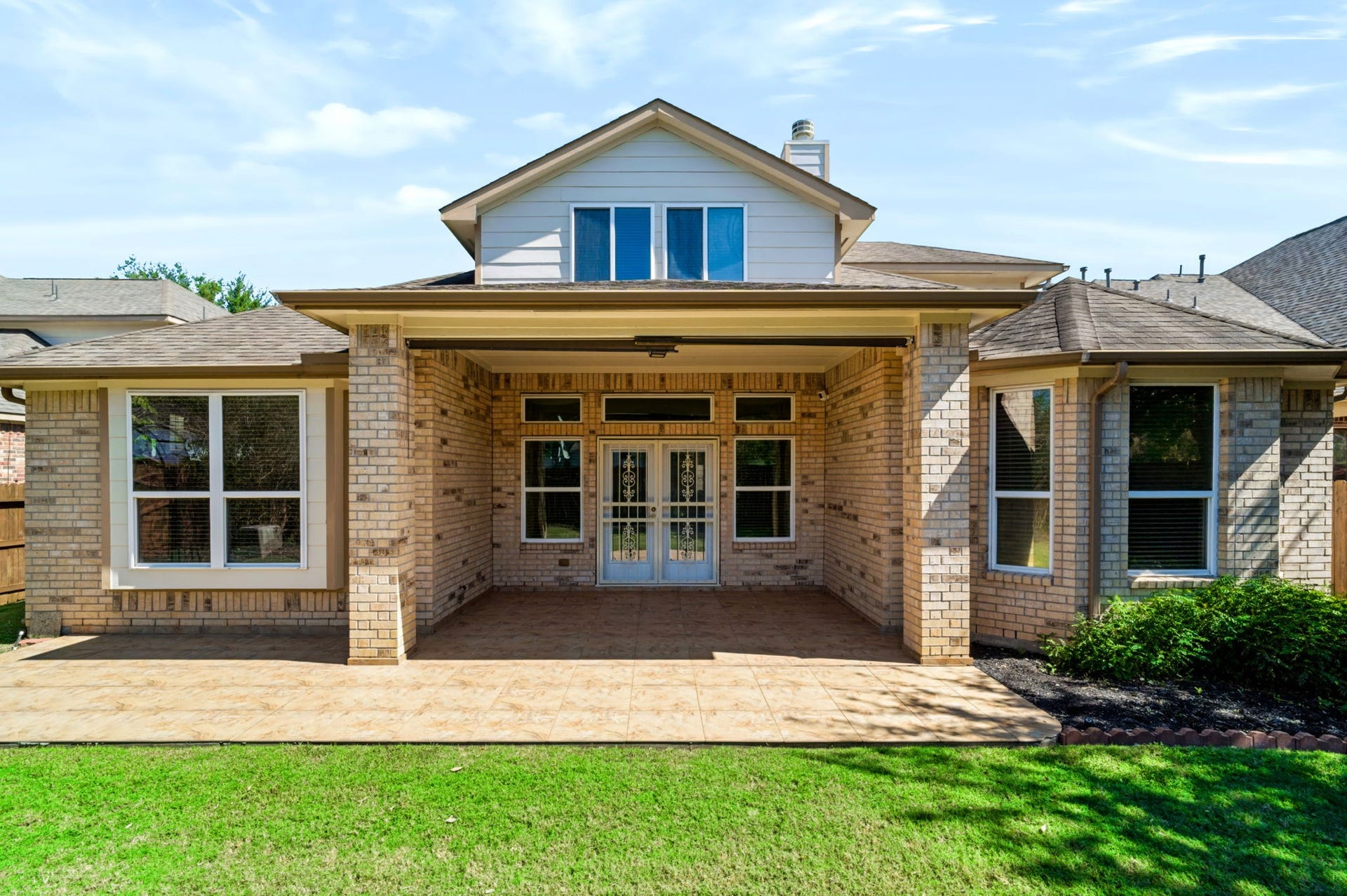 314 Trillium Drive, Sugar Land, TX 77479 French doors with exterior gates provide enhanced security.