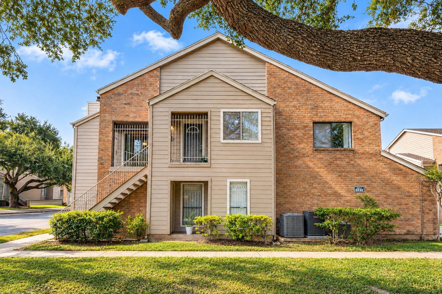 6701 Sands Point Drive, #61, Houston, TX 77074 The view from the front windows shows mature trees and lovely landscaping.