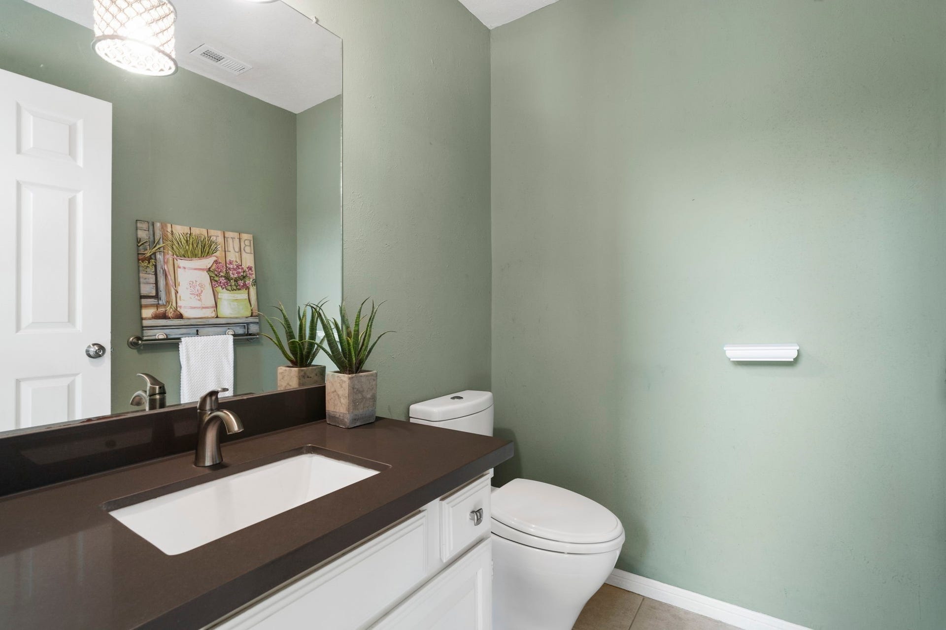 2915 Cane Field Drive, Sugar Land, TX 77479 Convenient half bath with a sleek vanity & modern finishes.